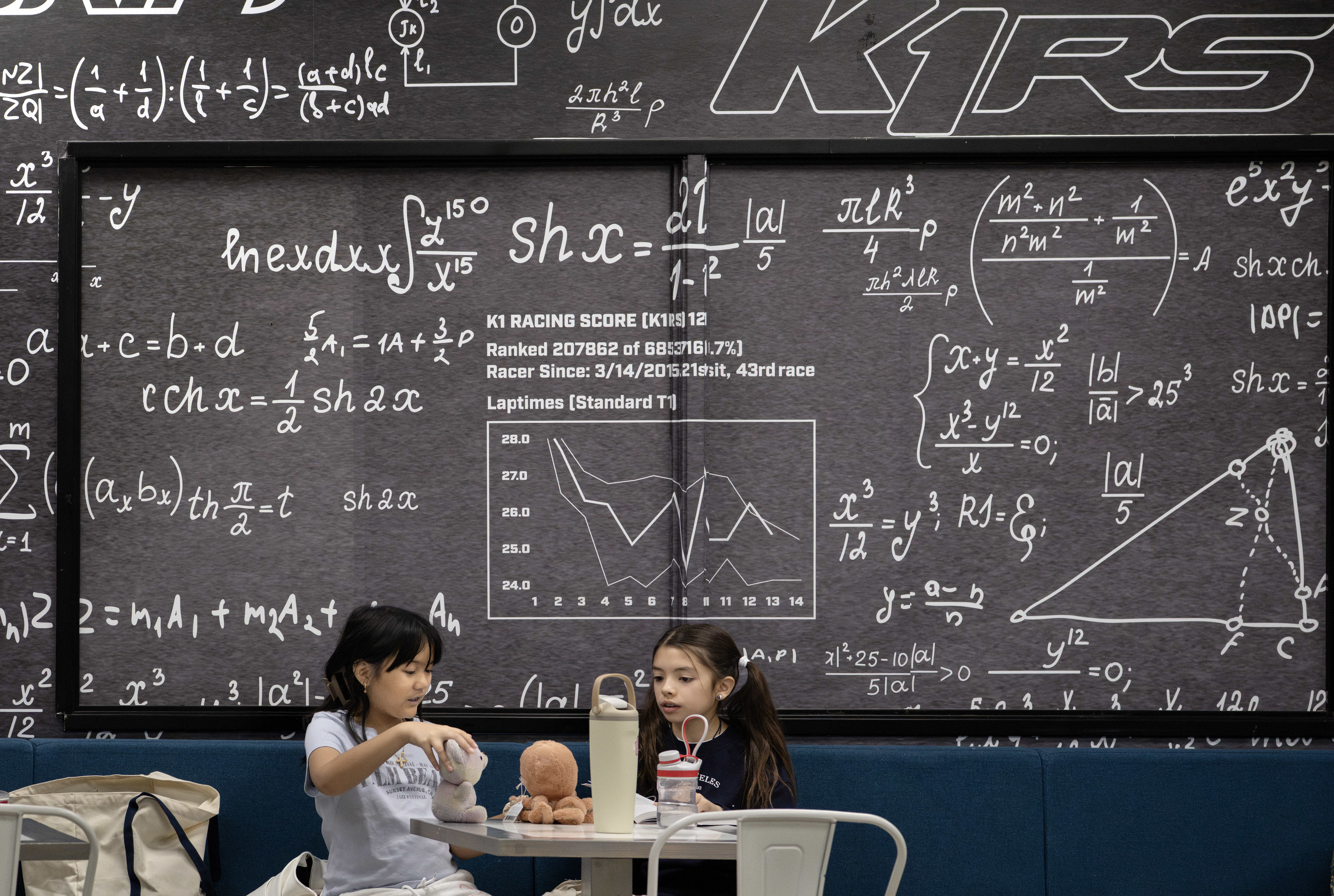 Jiana Alagot, 9, left, and Berlyn Niedjelski, 10, occupy themselves...
