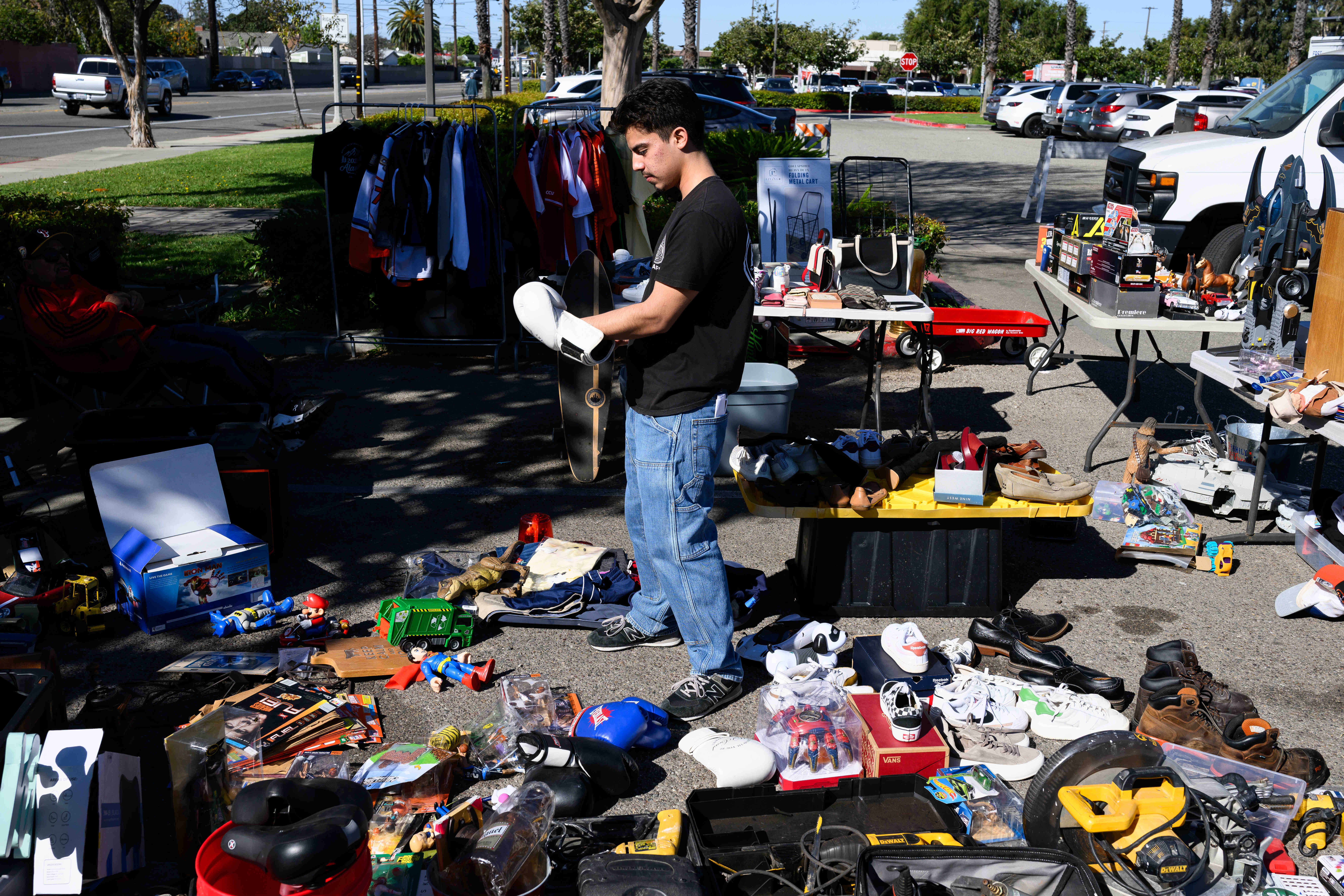 Jonathan Sanchez tries on a boxing glove during a community...