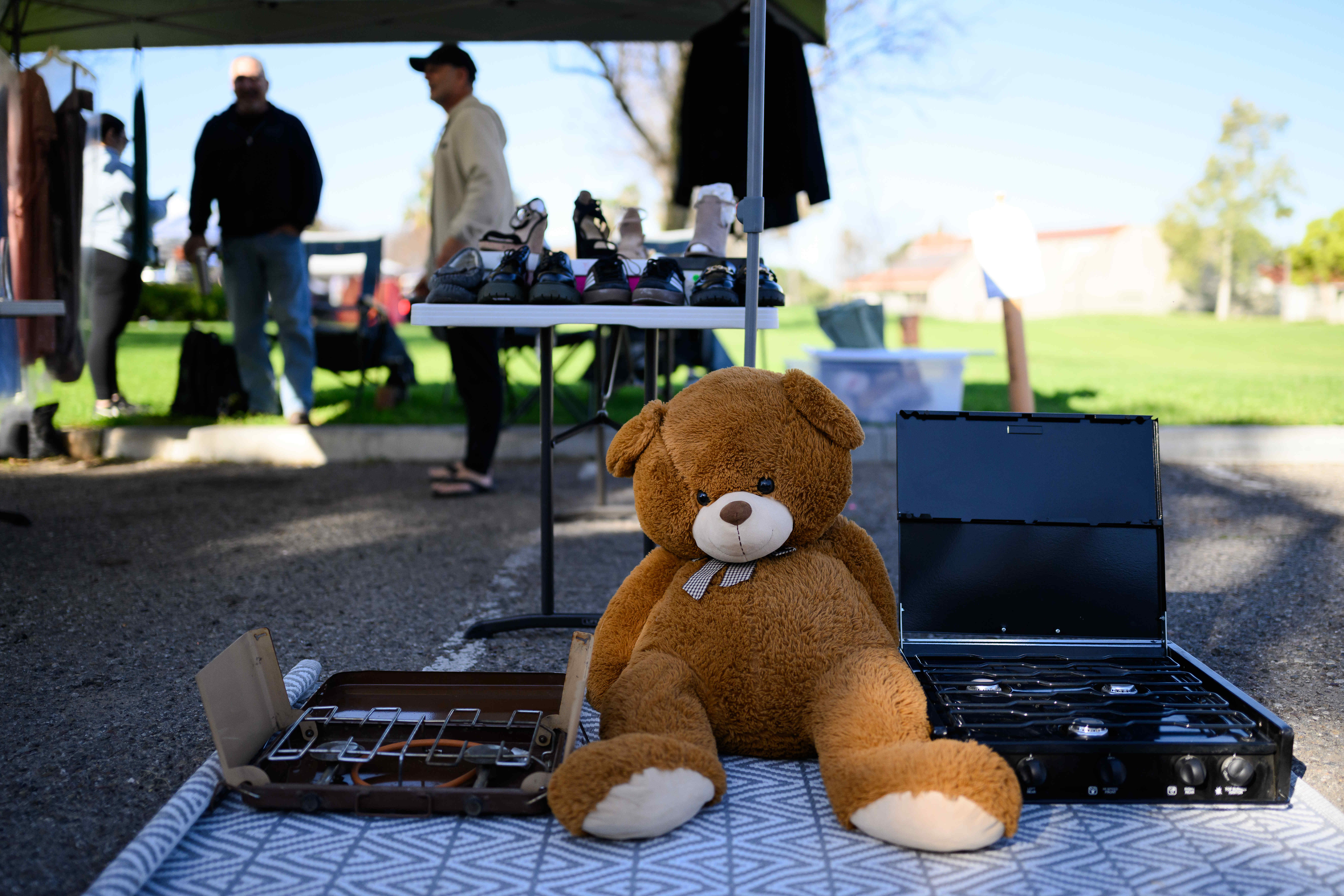 A teddy bear plushie sits on display during a community...