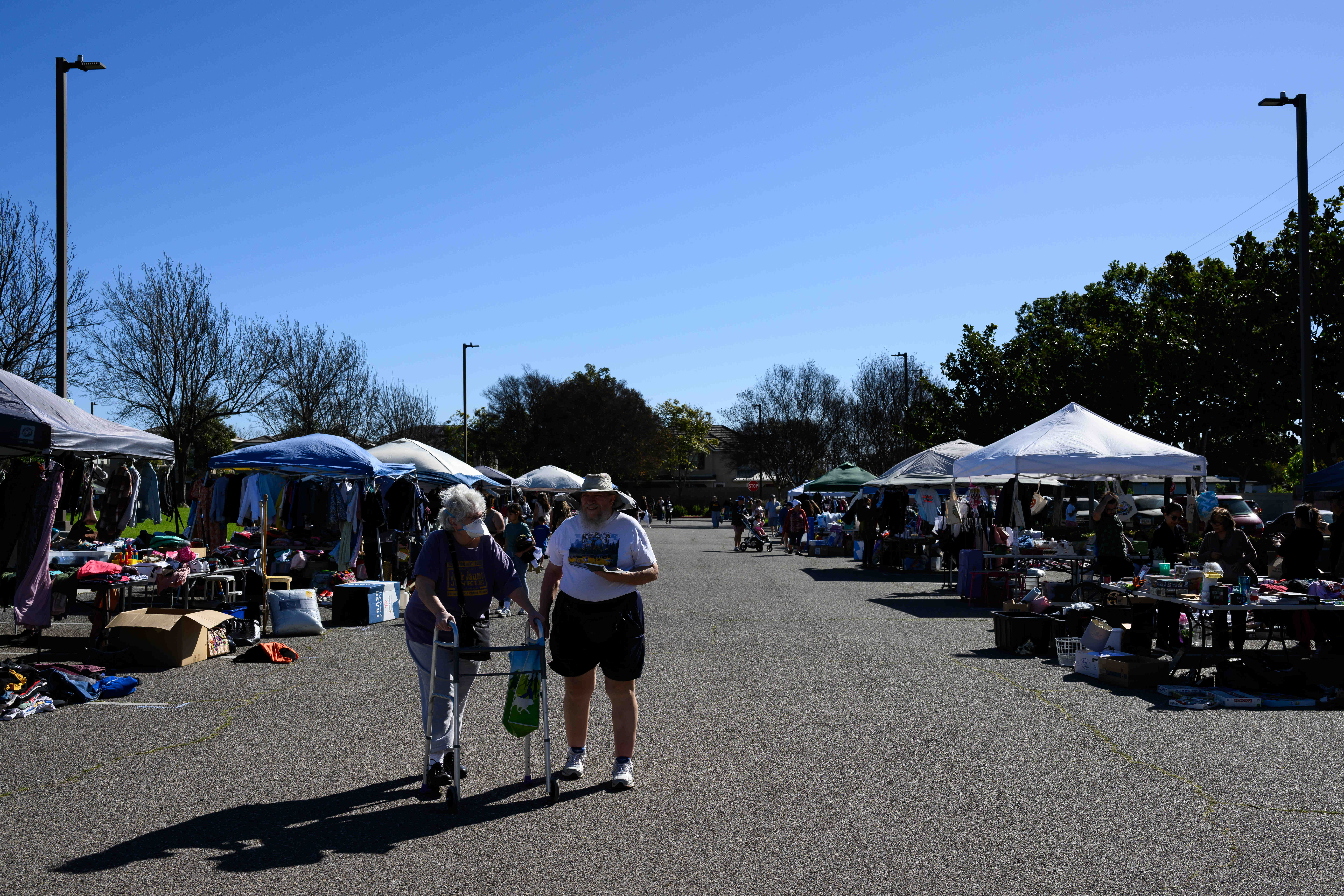People visit a community yard sale held by the City...