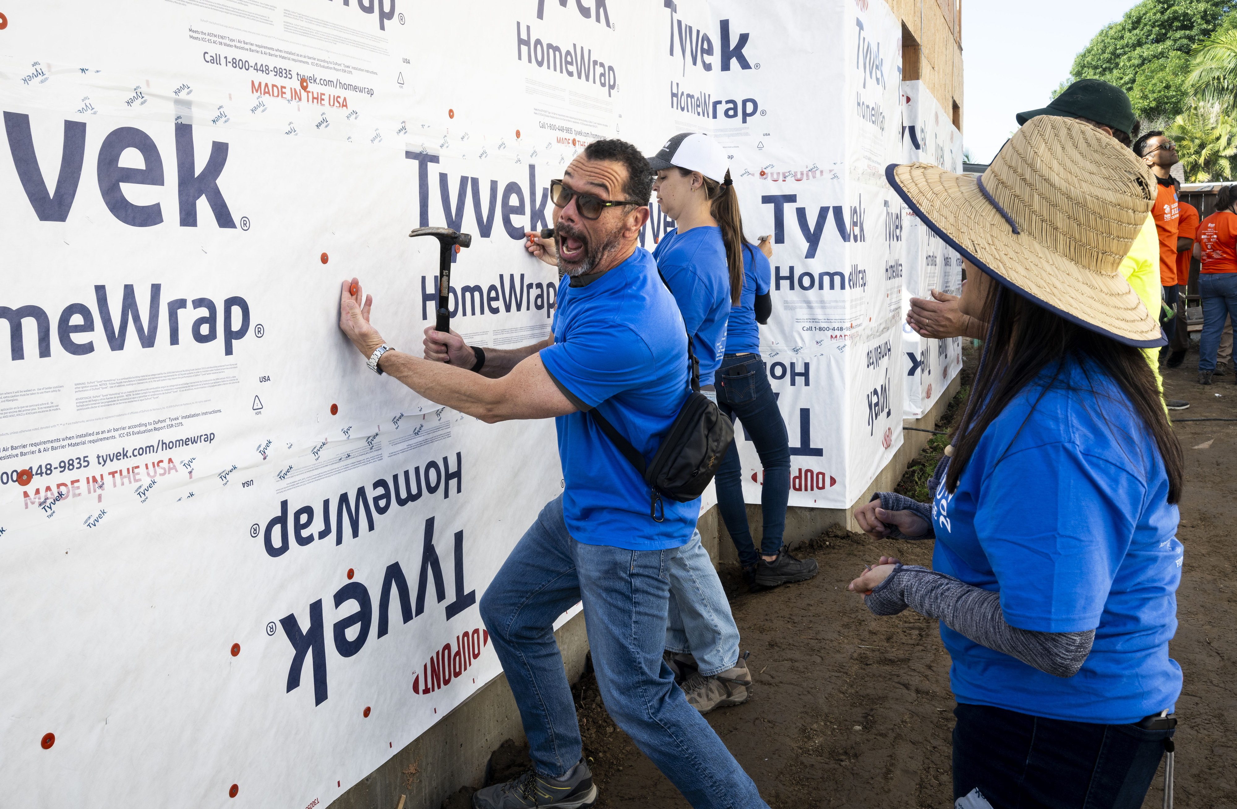 CJ Bibolet, with City National Bank, clowns around while working...