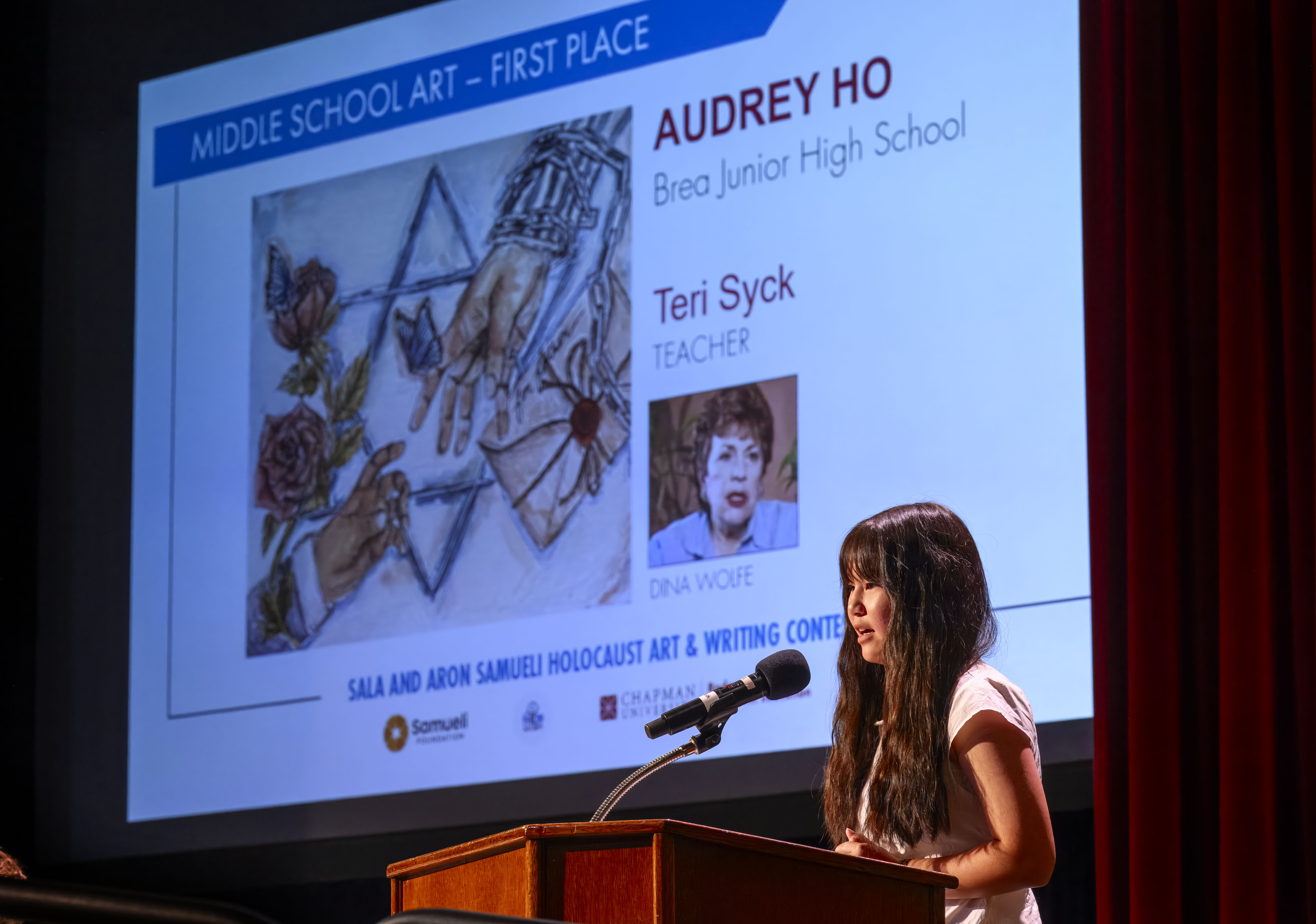 Audrey Ho of Brea Junior High School presents her art...