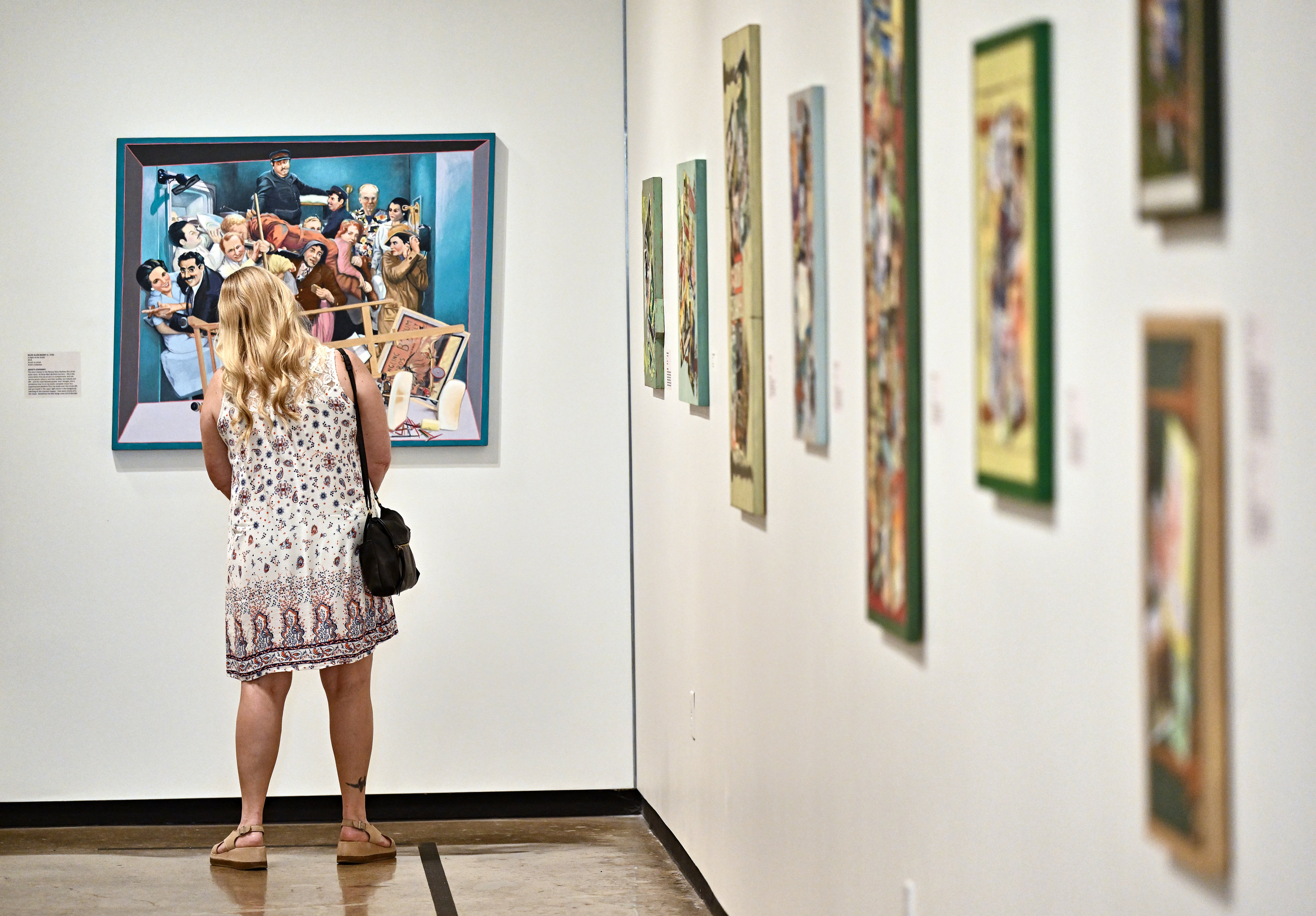 Michaelle (cq) Carmody checks out artwork at The Hilbert Museum...