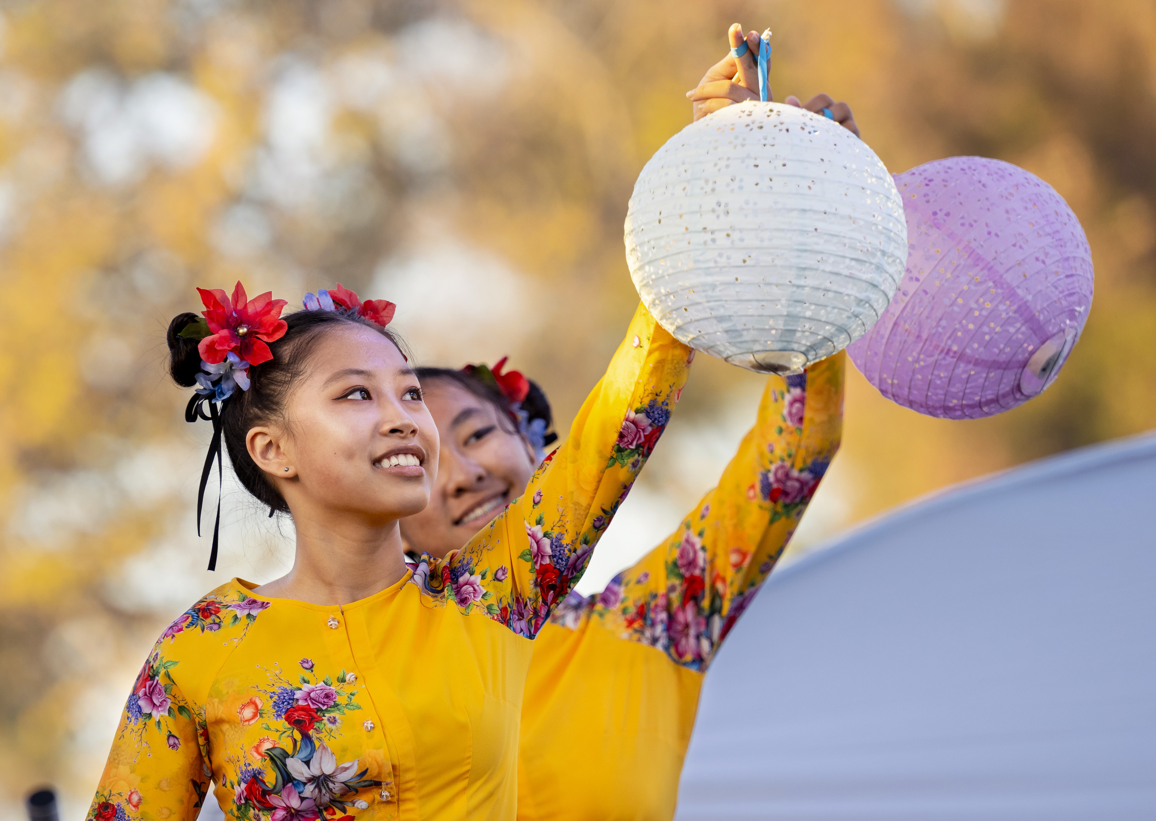 Dressed traditional clothing dancers perform on stage during the annual...