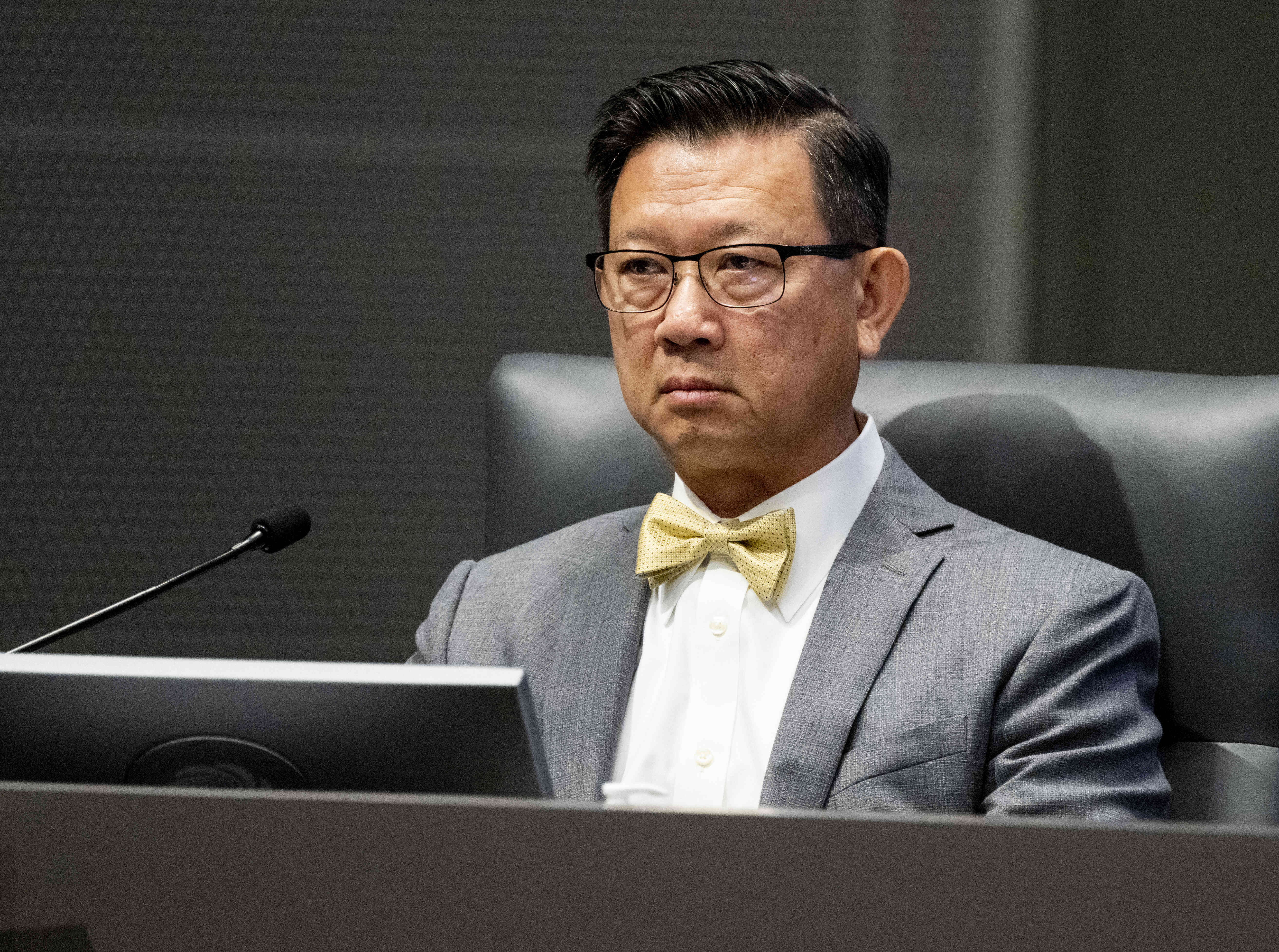 Orange County Supervisor Andrew Do listens during the supervisors’ meeting...