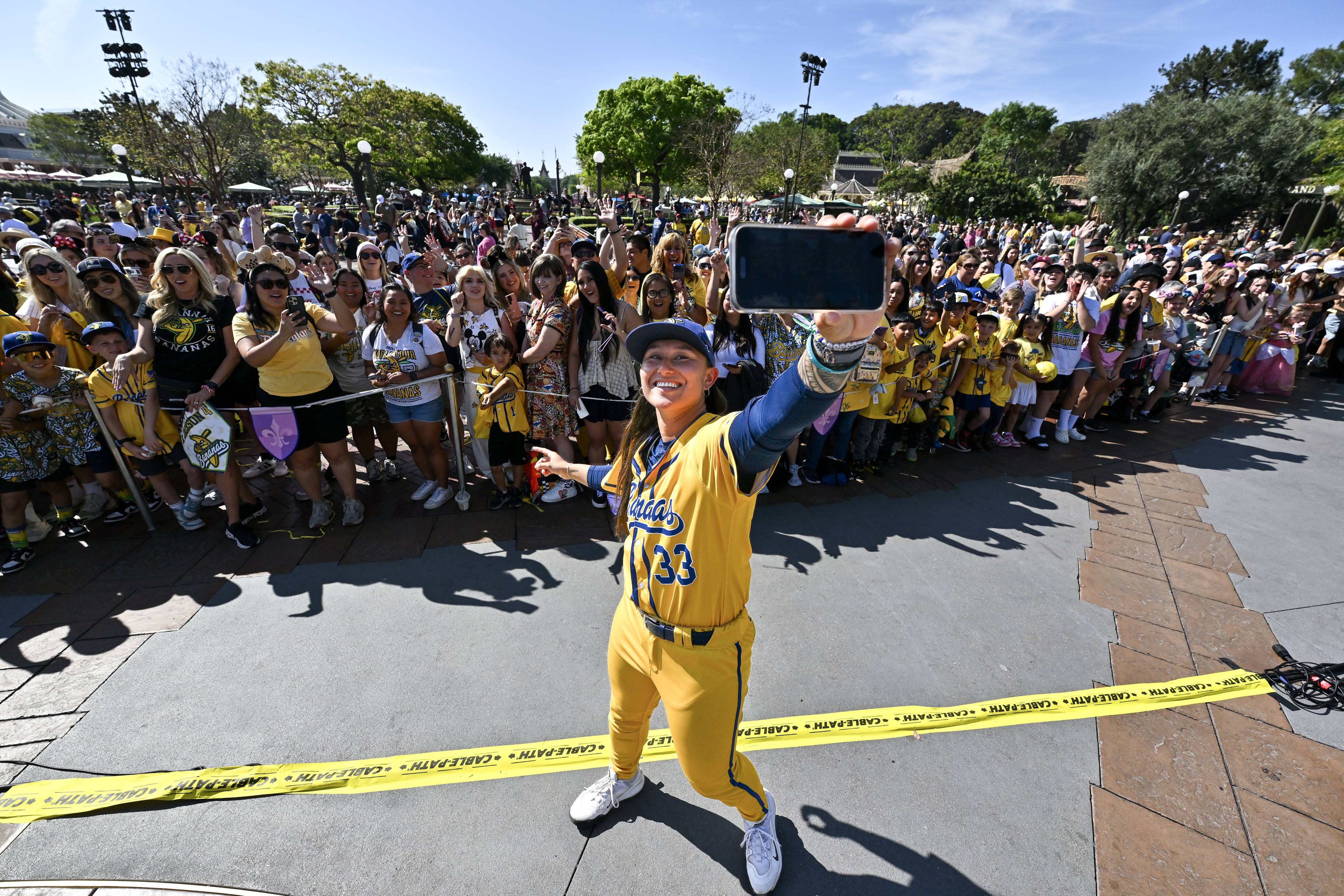 Savannah Bananas pitcher Kelsie Whitmore (33) takes a selfie with...