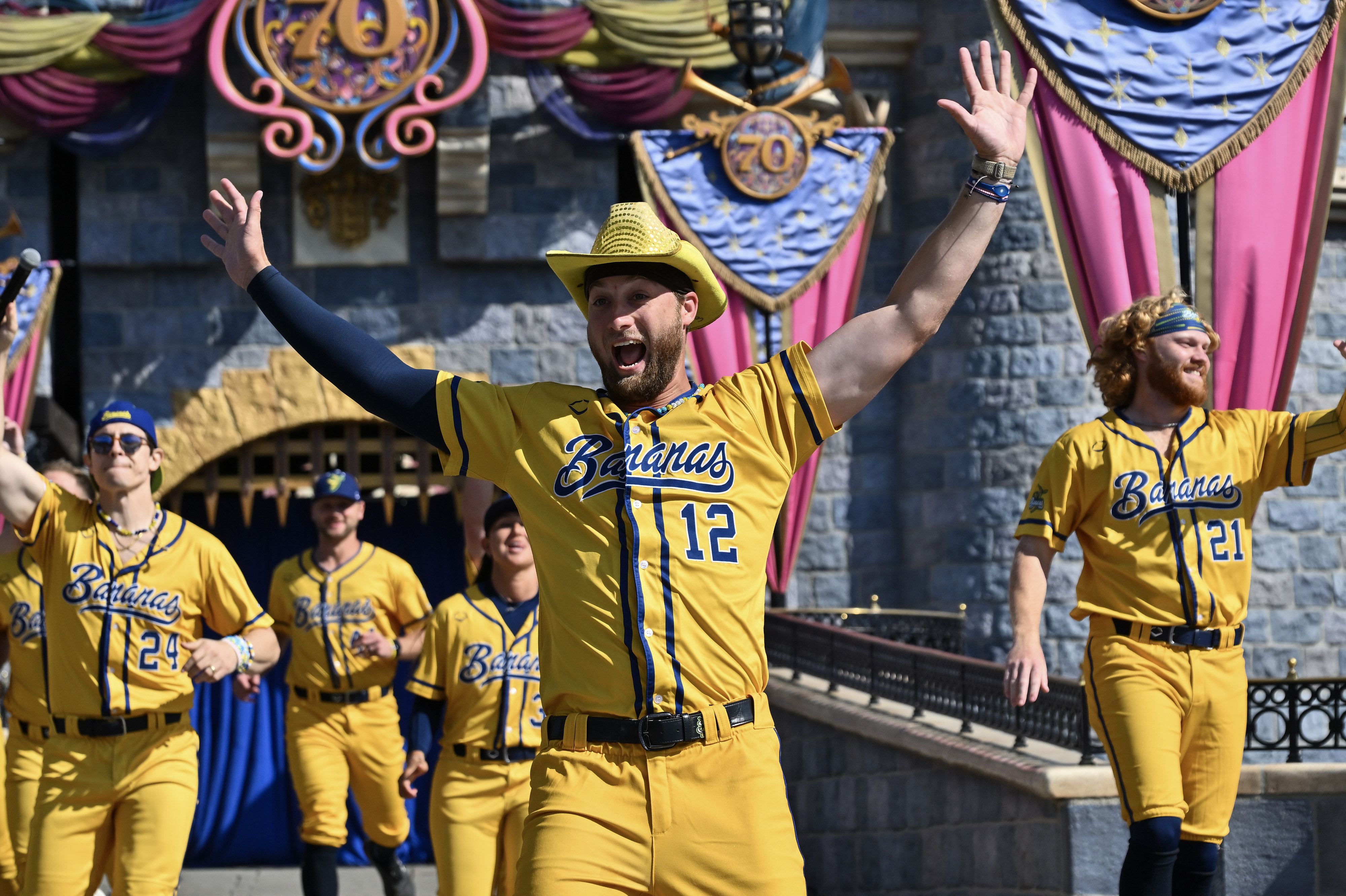 Savannah Bananas, pitcher Kyle Luigs (12) greets fans as he...