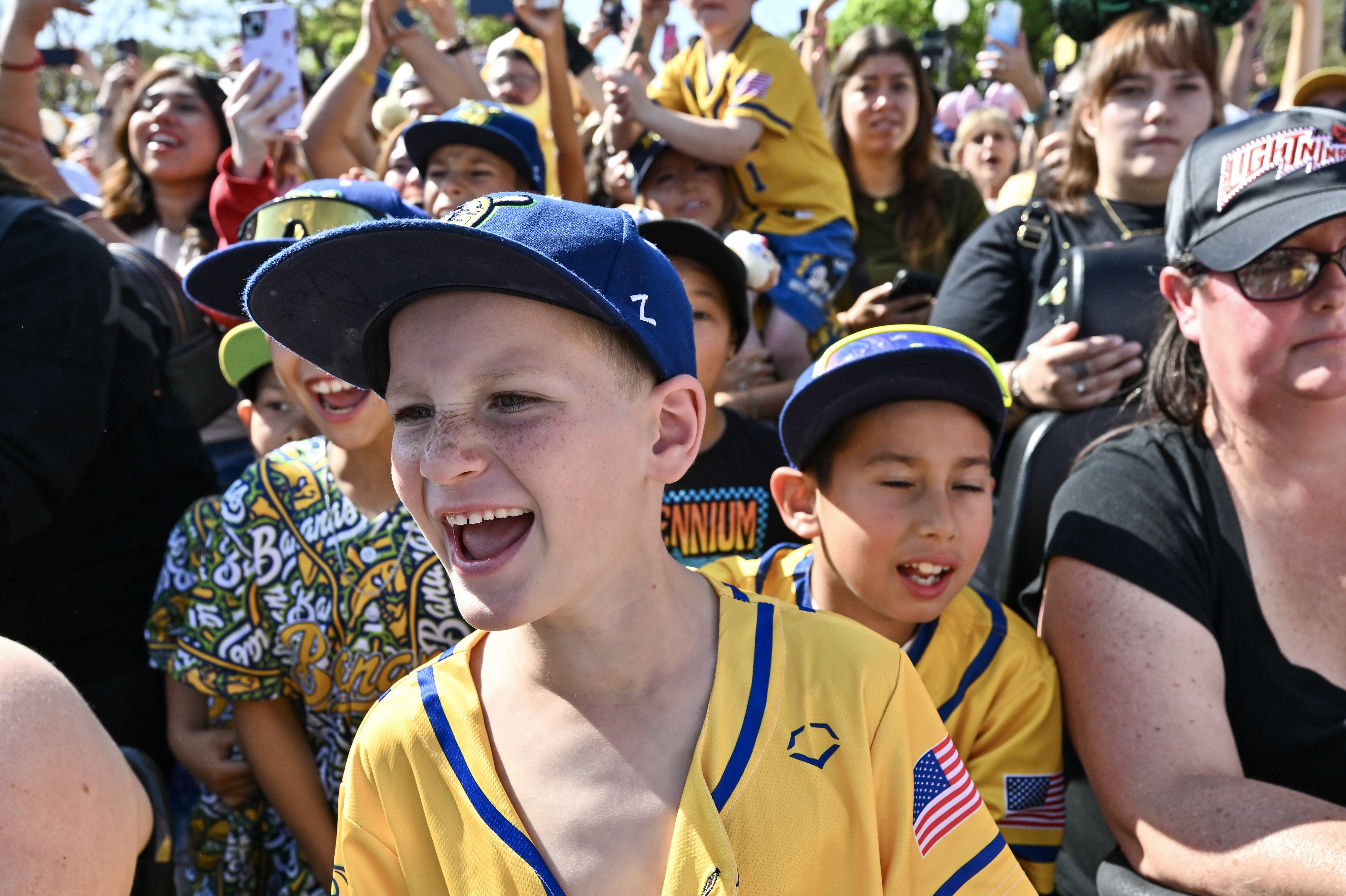 Carter Mundy, 7, watches the Savannah Bananas perform in front...