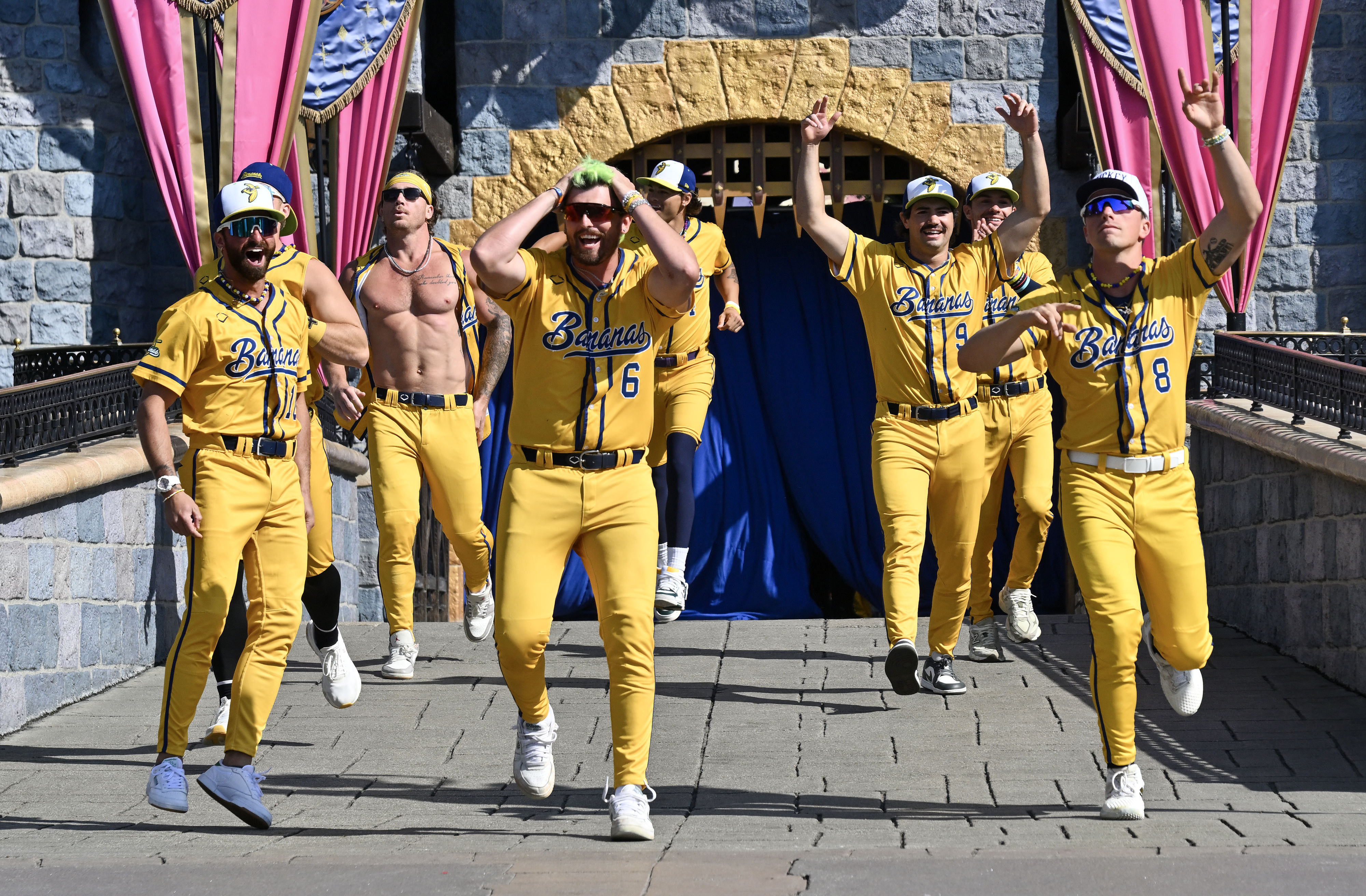 Savannah Bananas infielders greets fans in front of Sleeping Beauty...