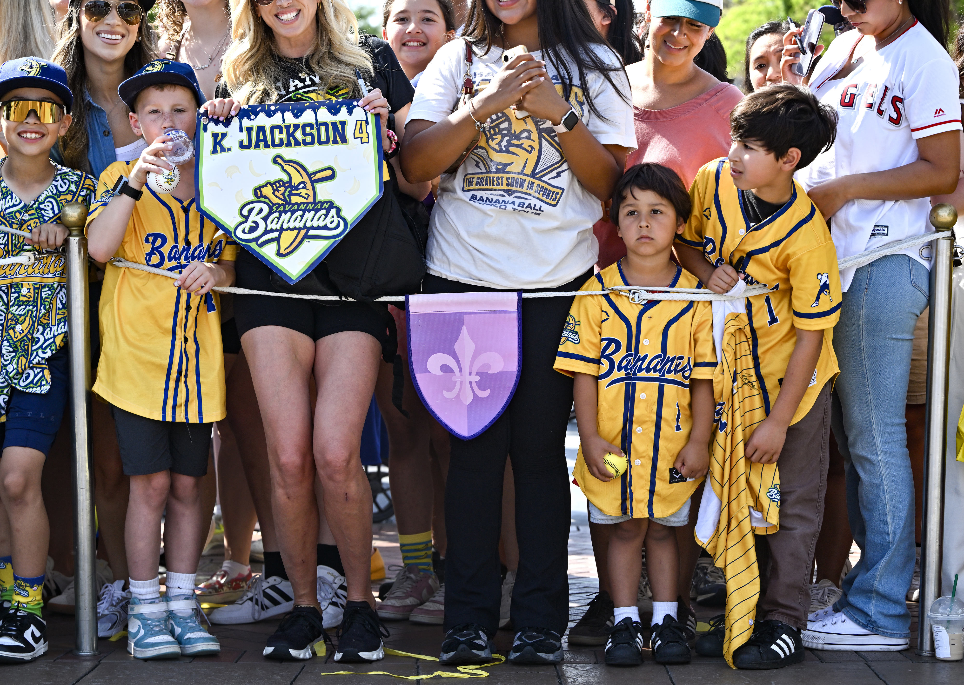 Fans wait for the Savannah Bananas in front of Sleeping...