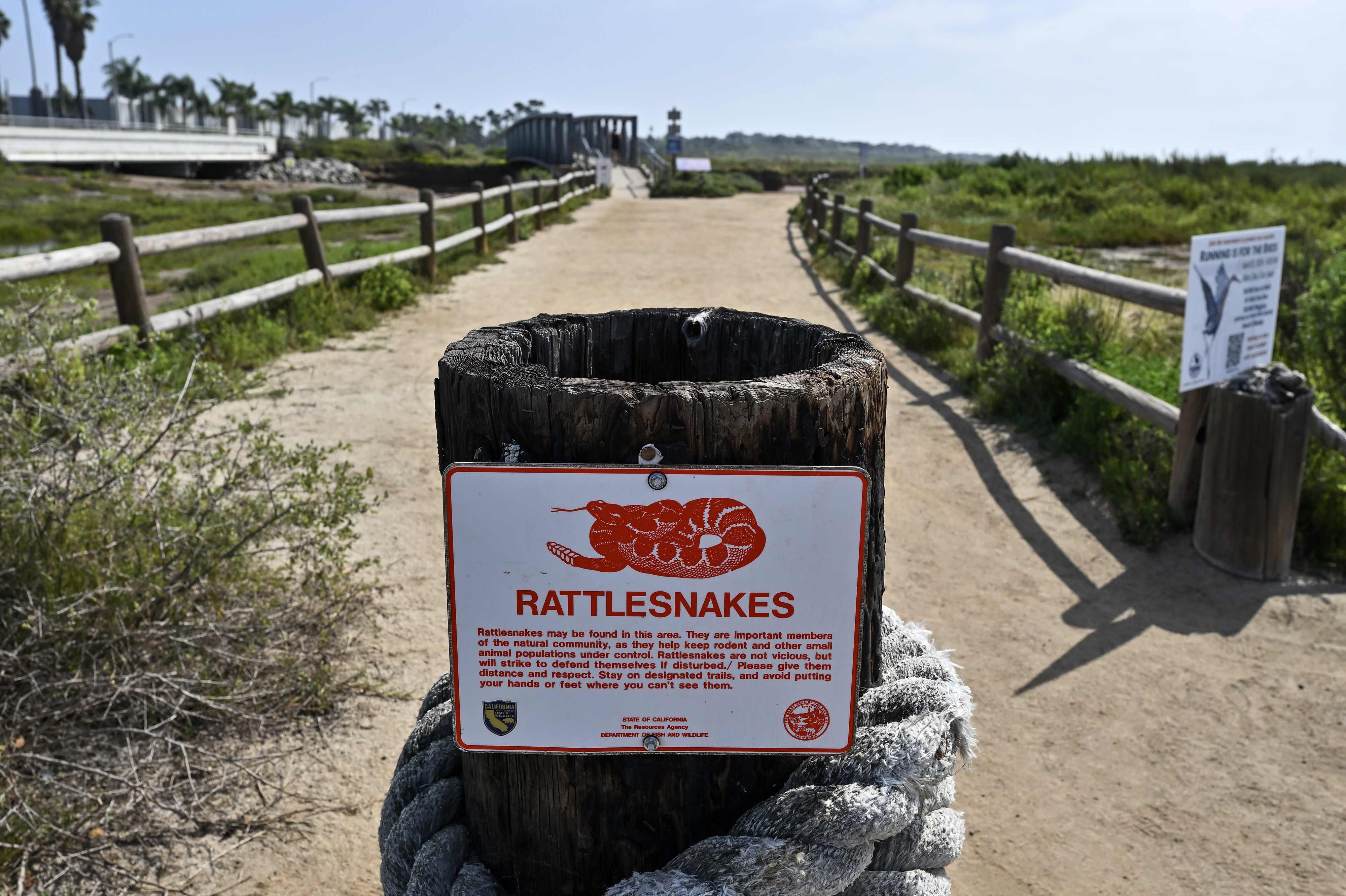 A sign warns visitors to be on the lookout for...