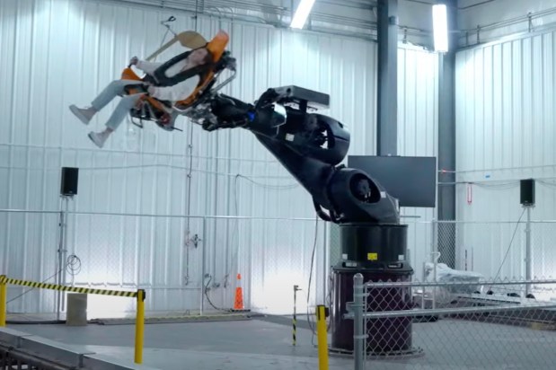 A Kuka RoboCoaster motion simulator robot arm for Stark Flight Lab undergoing testing in a still frame from a Walt Disney Imagineering video posted to YouTube. (Courtesy of Disney)