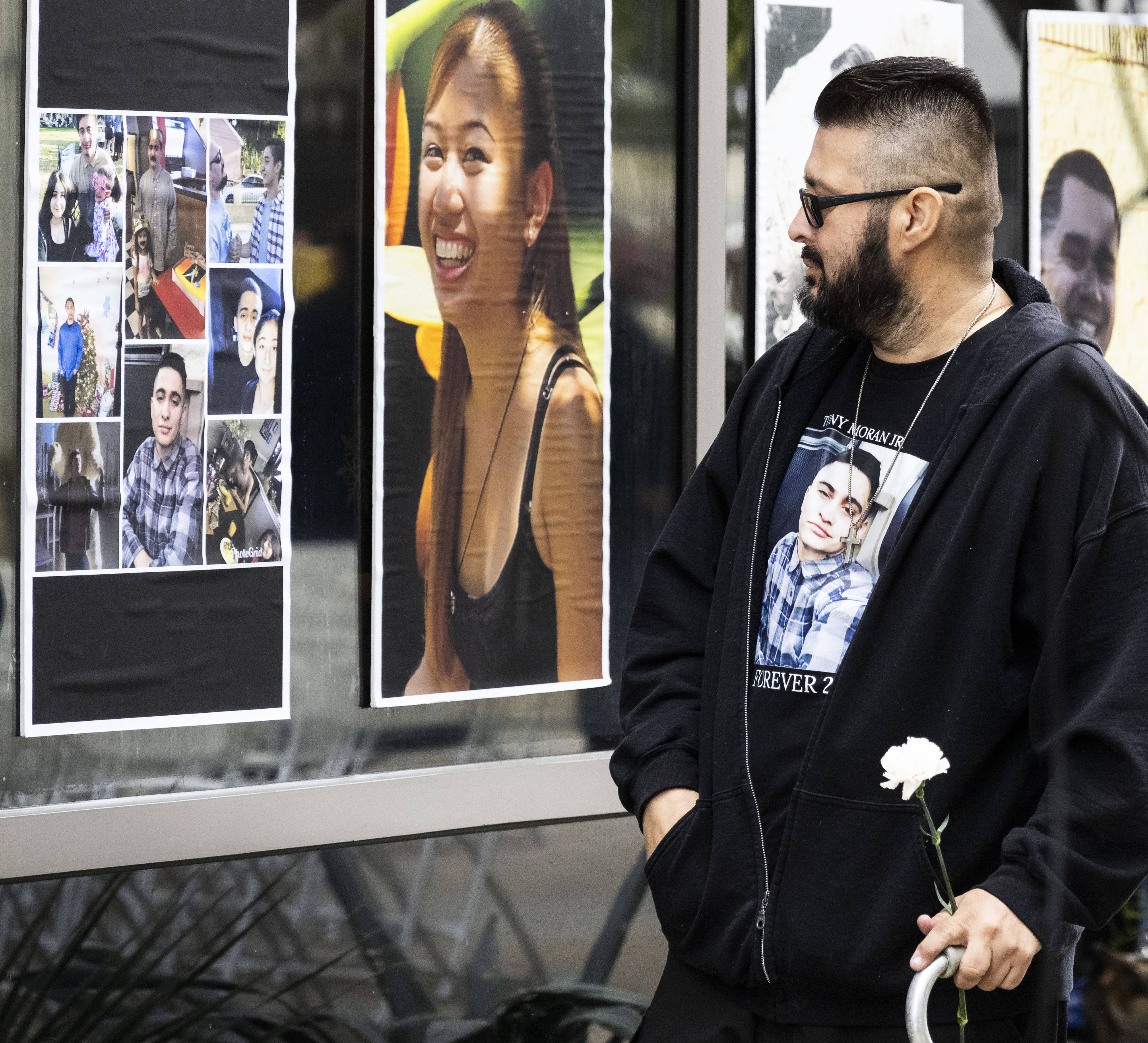Tony Moran pauses at a photo of his son, Tony...
