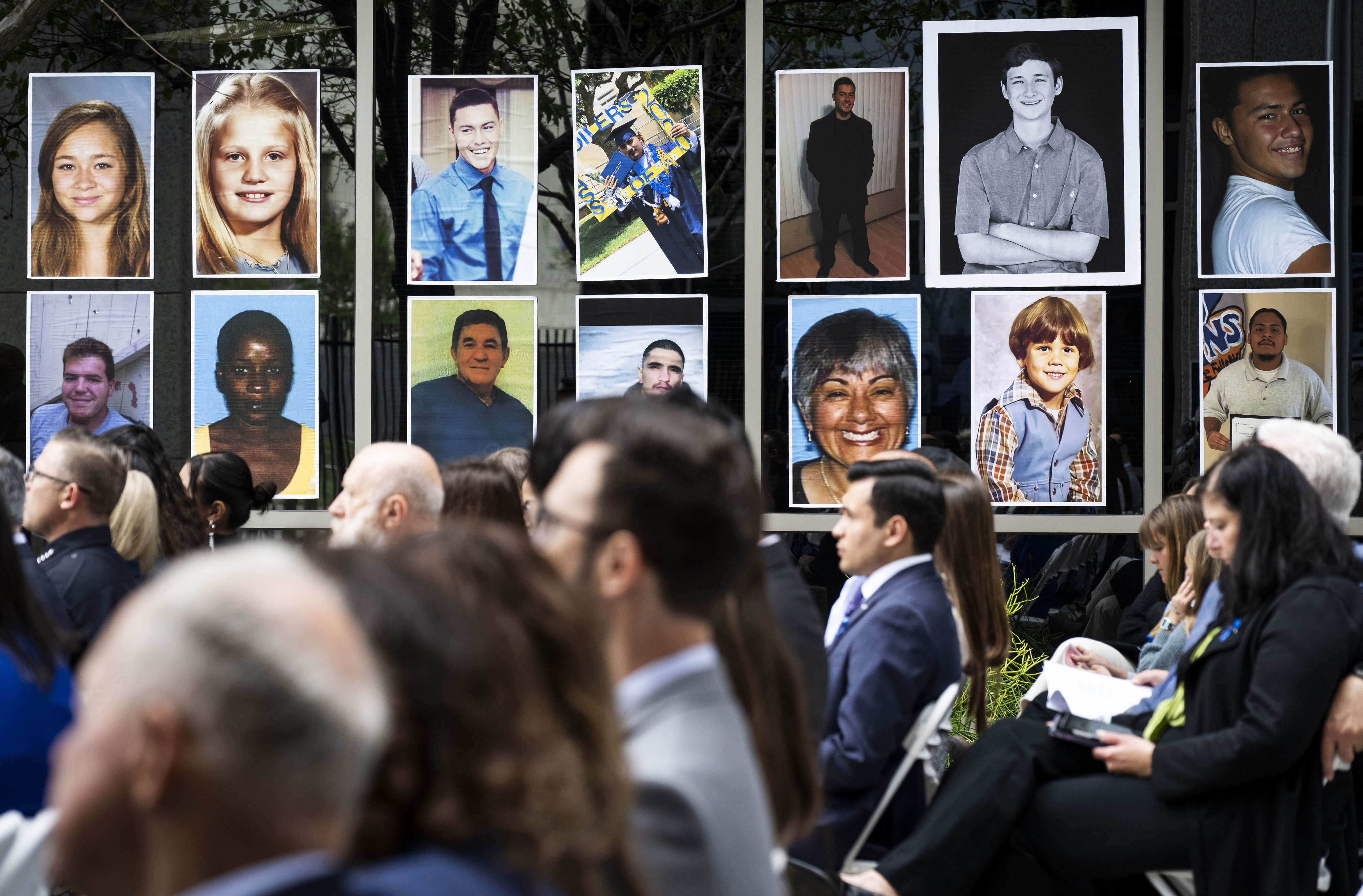Portraits of crime victims line the perimeter at the Crime...