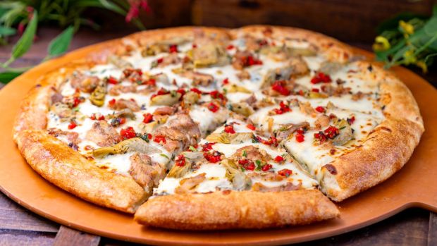 Chicken Spinach Artichoke Dip Pizza Slice available at the Disney California Adventure Food & Wine Festival. (Courtesy of Disneyland)