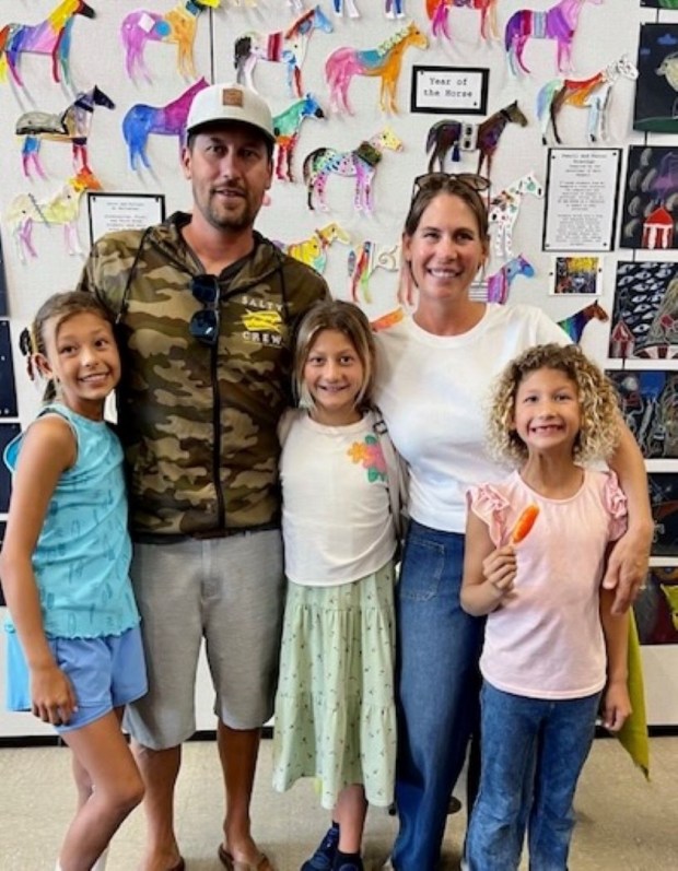 Aaron and Liz Garcia brought their children, Quinn, Avery and Zoey, to Crown Point Junior Music Academy's annual art show on March 13. (Courtesy of Liz Garcia)