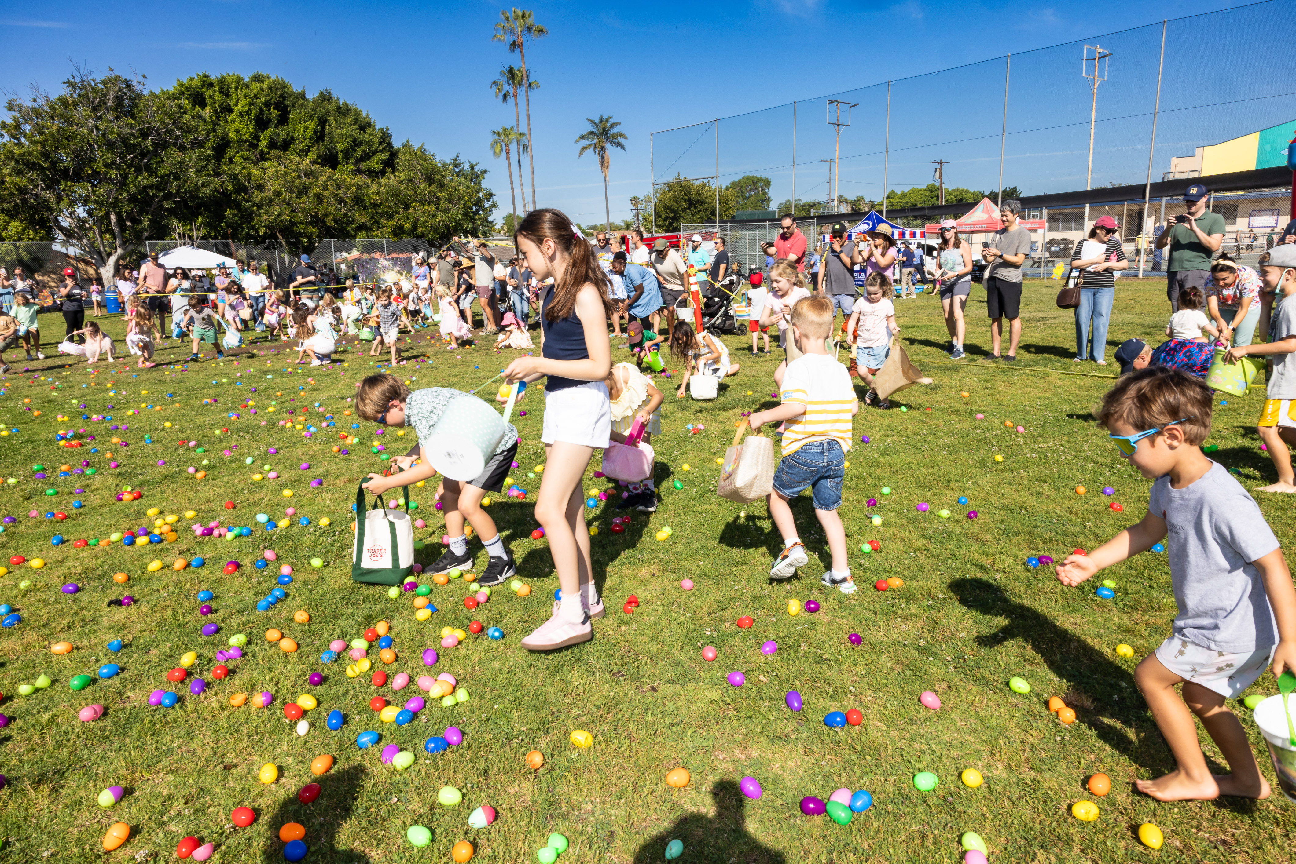Children gathering eggs at the Pacific Beach Recreation Center egg...