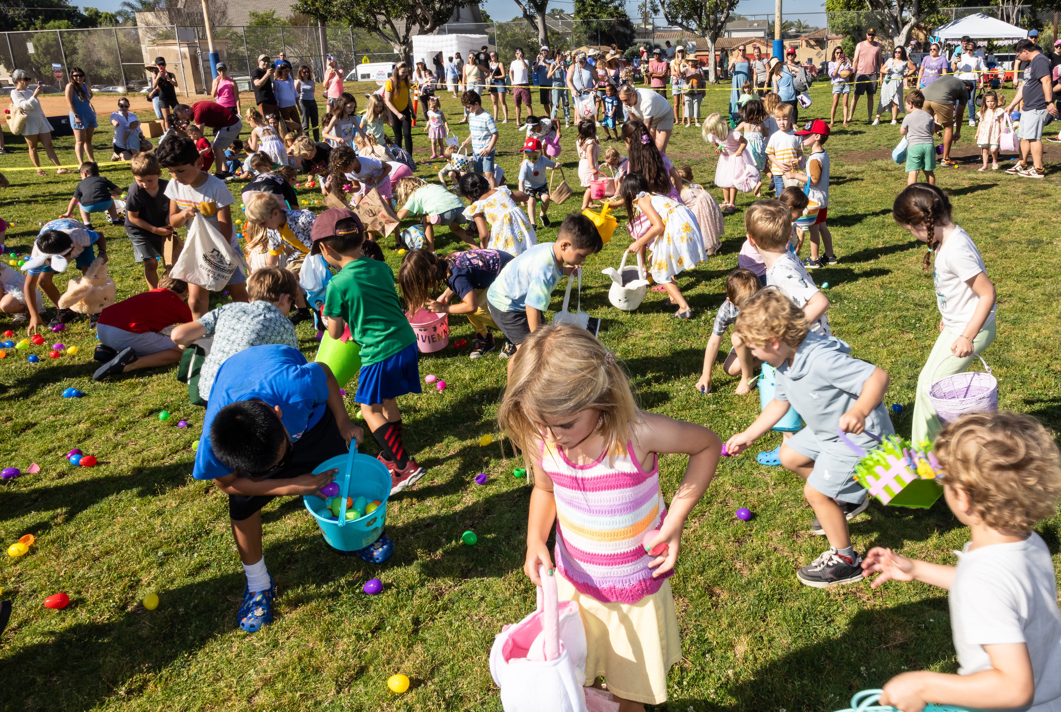 Children gathering eggs at the Pacific Beach Recreation Center egg...