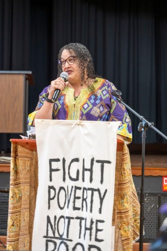Robynne Rose-Haymer, former member of the Sacramento Services Not Sweeps Coalition and current Vice President of Programs at the San Diego Workforce Partnership, delivers the keynote address at the “Fight Poverty, Not the Poor” festival. Russell Stiger Jr., OBSERVER