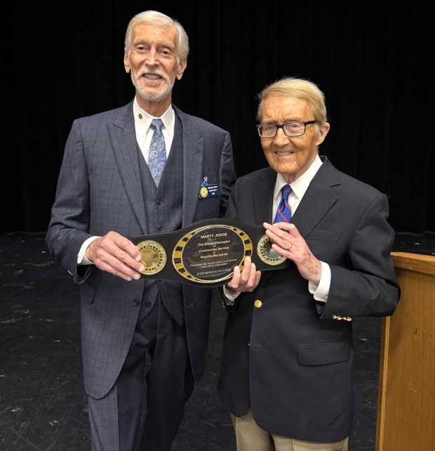 Hats Off to Volunteers co-chair Scott Lawn surprised his fellow co-chair, Marty Judge, with an award to recognize Judge's many years of community service in Rancho Bernardo. (Alex Lawn)