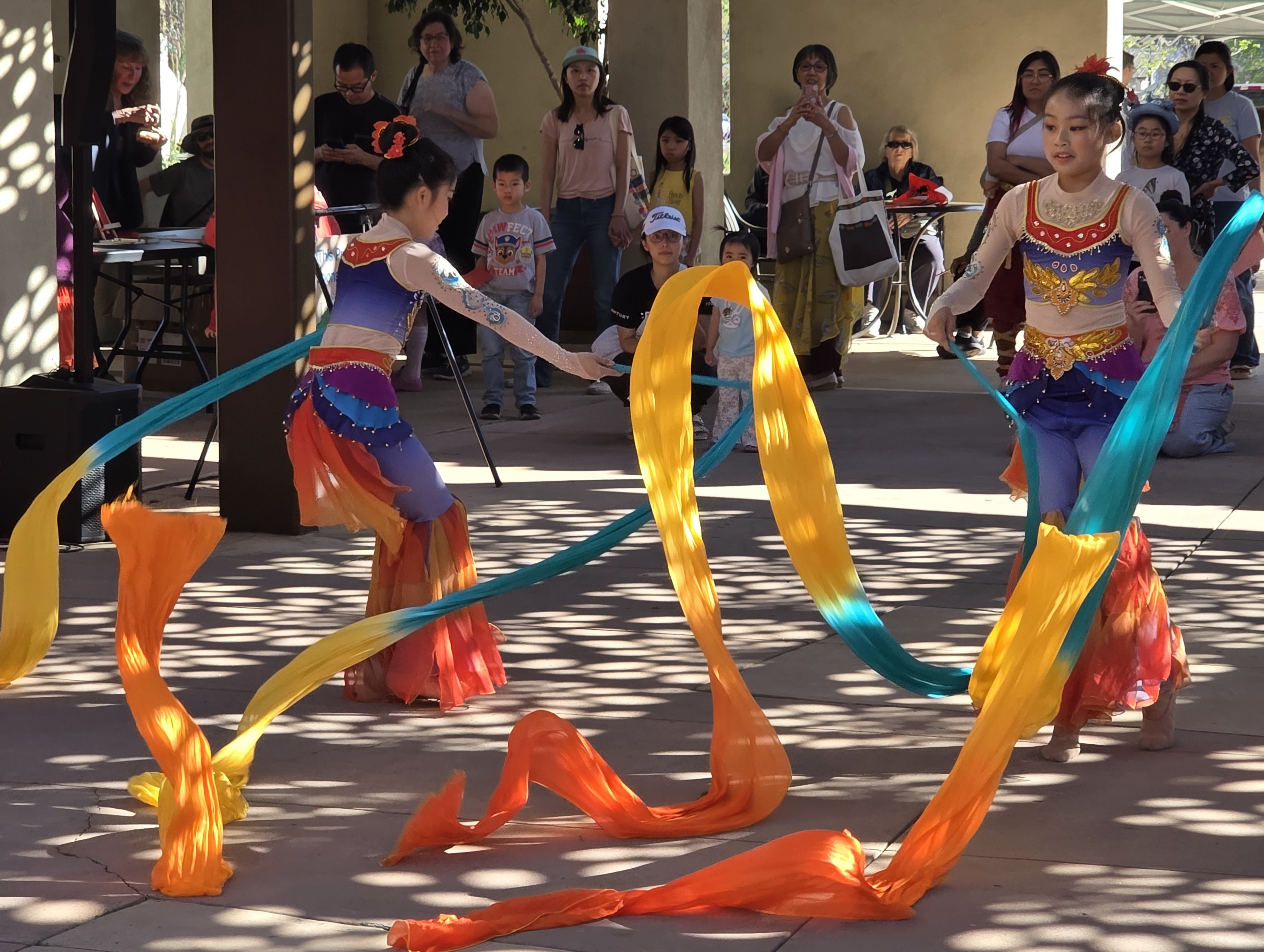 Traditional Chinese dancers waved colorful banners during their performance. (Julie...