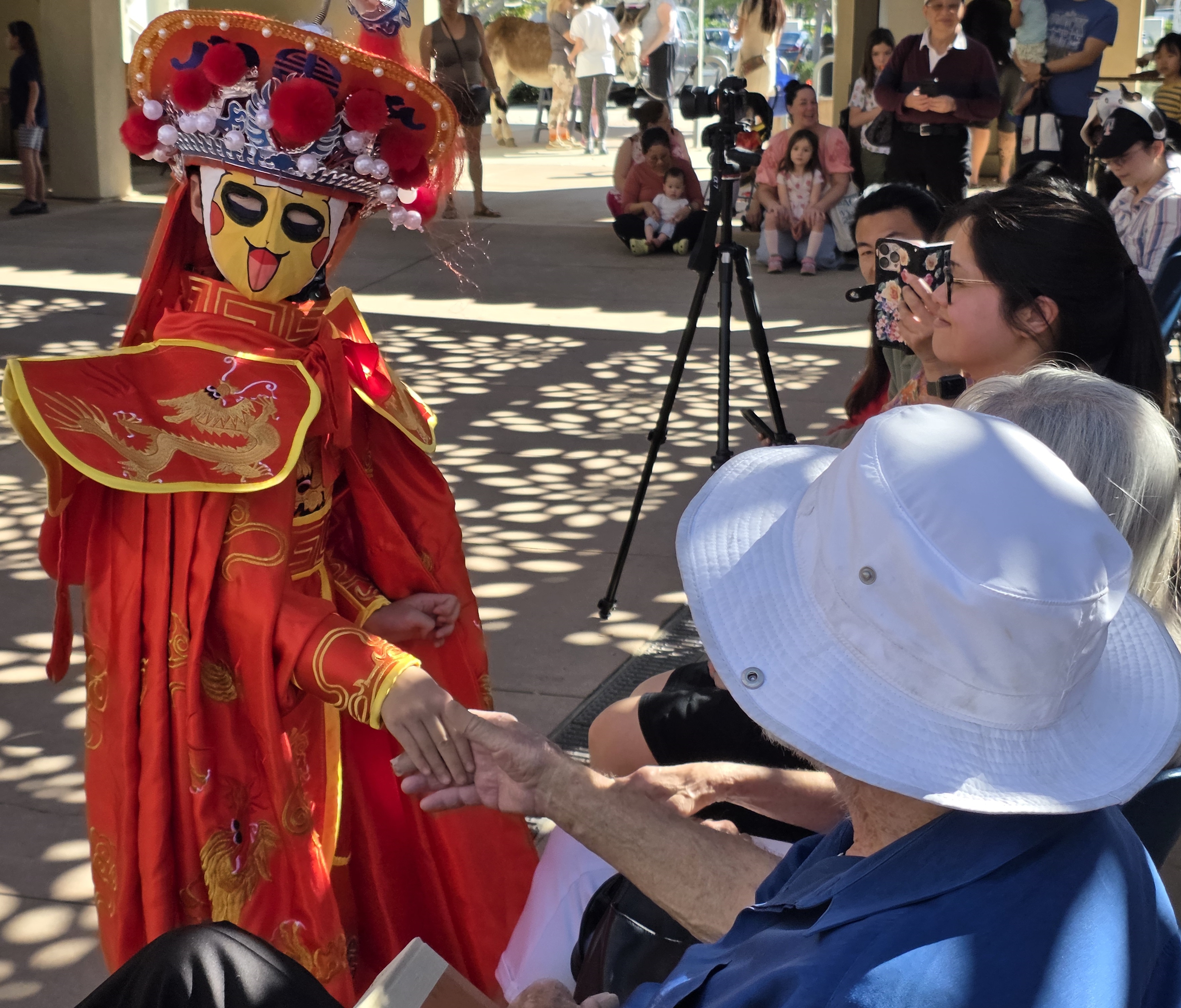 Danielle Yu greeted guests during her Face Changing performance at...