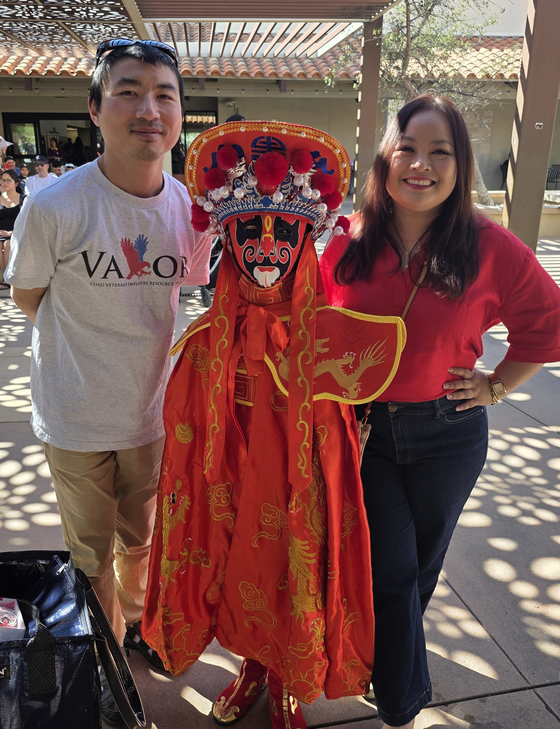 Nine-year-old Danielle Yu, center, shows her traditional Chinese face changing...