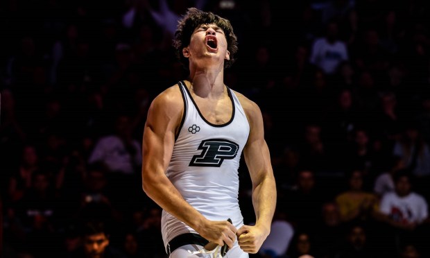 Poway High's Mario Carini reacts to his performance in a wrestling match last year. (Courtesy John Meyers)