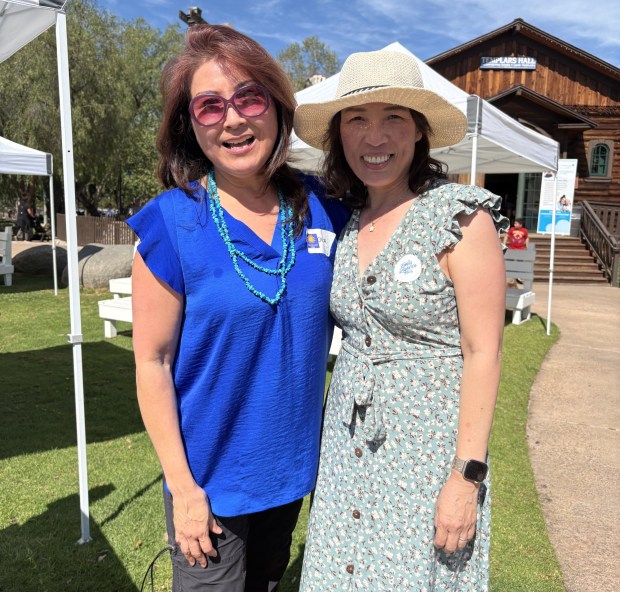 Carita Kim, PUSD volunteer parent ambassador with Regina Wang, PUSD's parent engagement liaison who coordinated the resource fair. (Amy Shireman)
