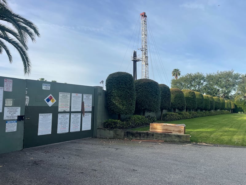 Photo of an oil drilling site from the outside.