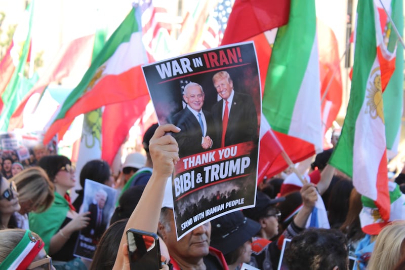 Participants voiced support for President Trump and Israeli Prime Minister Benjamin Netanyahu, carrying signs with their images and quotes as well as American and Israeli flags. (Photo by Charlotte Calmès)