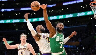 Jaylen Brown (right) and LeBron James (center) battle for a rebound in Boston's 111-89 win over the Lakers on Feb. 22.