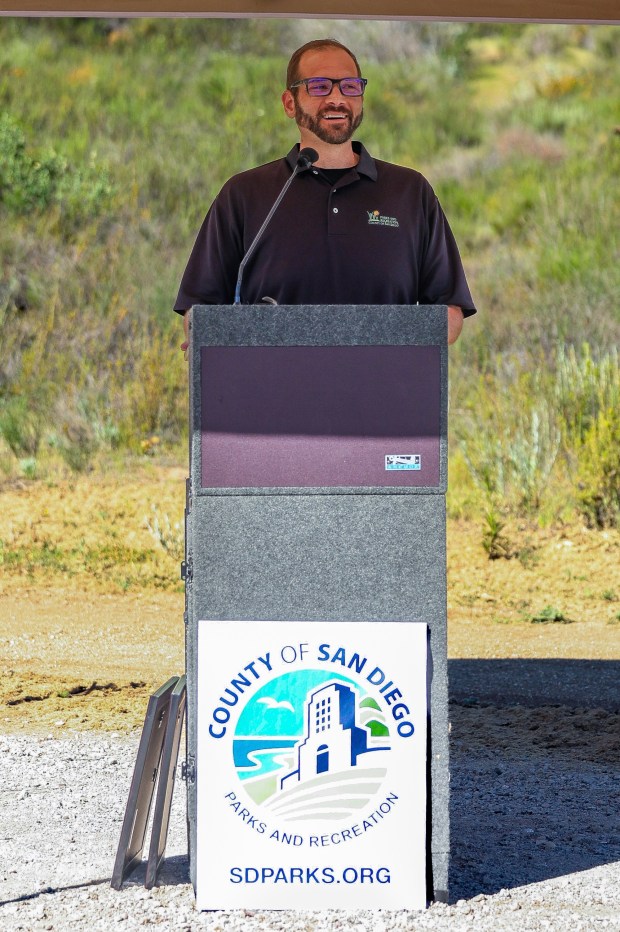 San Diego County Parks and Recreation Director Jason Hemmens welcomes guests to the Mount Woodson Gateway County Preserve parking lot ribbon-cutting ceremony on Wednesday, March 18. The new parking lot provides safer parking for hikers on the 84-acre preserve. The new parking lot has approximately 200 public parking spaces, including seven Americans with Disabilities Act-accessible spaces. (Stephanie Rene Ogilvie)