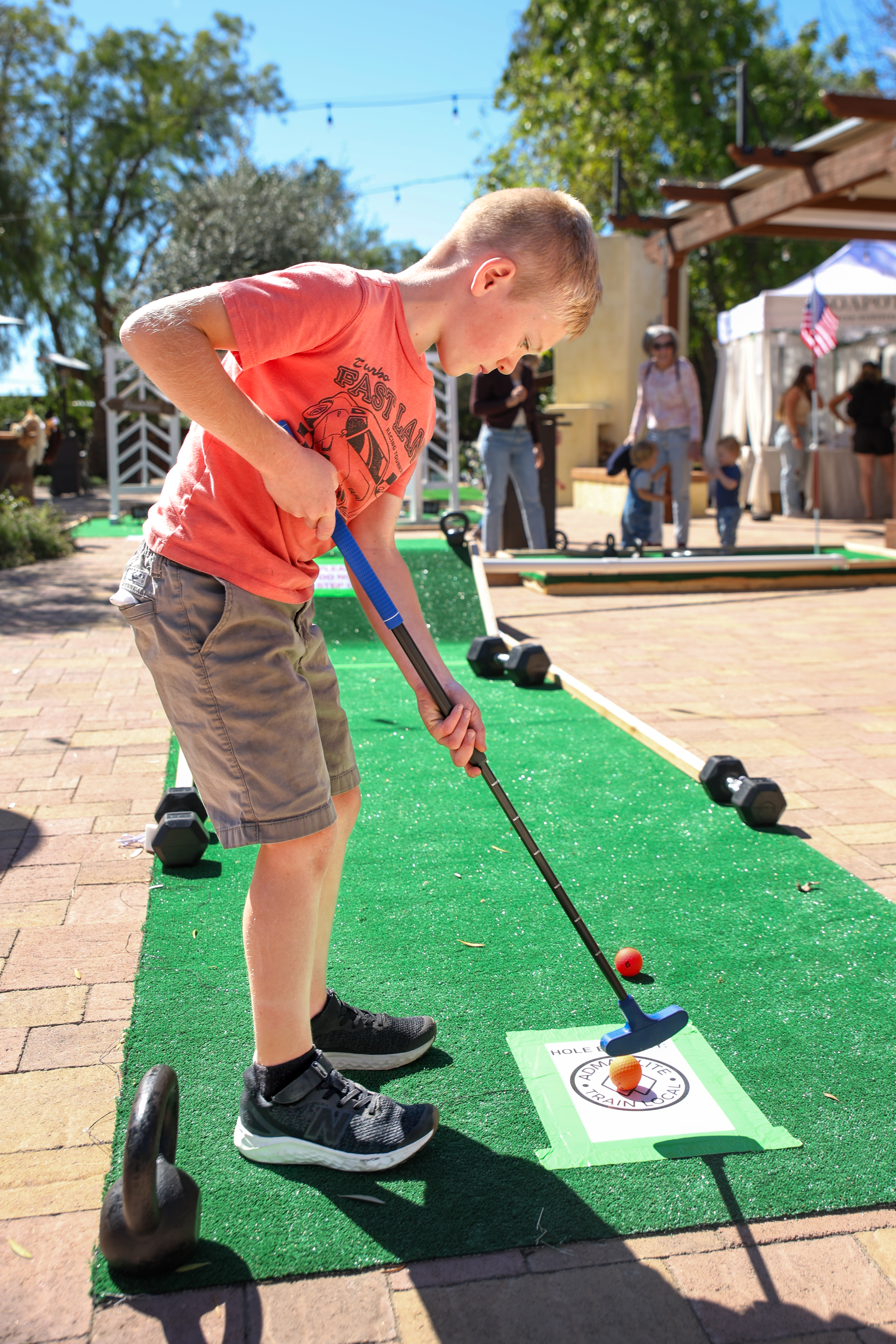 Eight-year-old Canaan Huff takes a few swings on the ADMA...