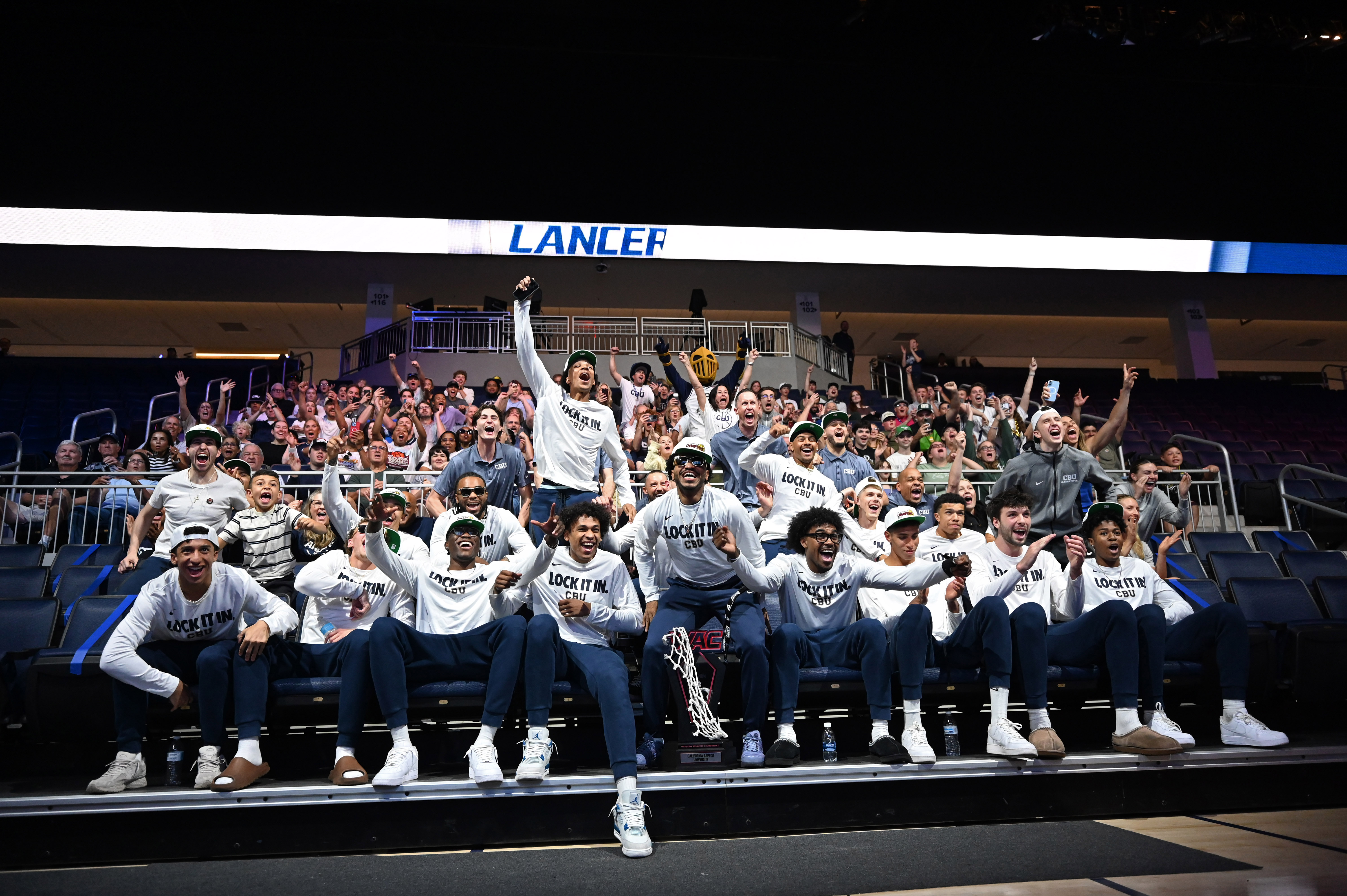 The California Baptist University men’s team reacts during a watch...