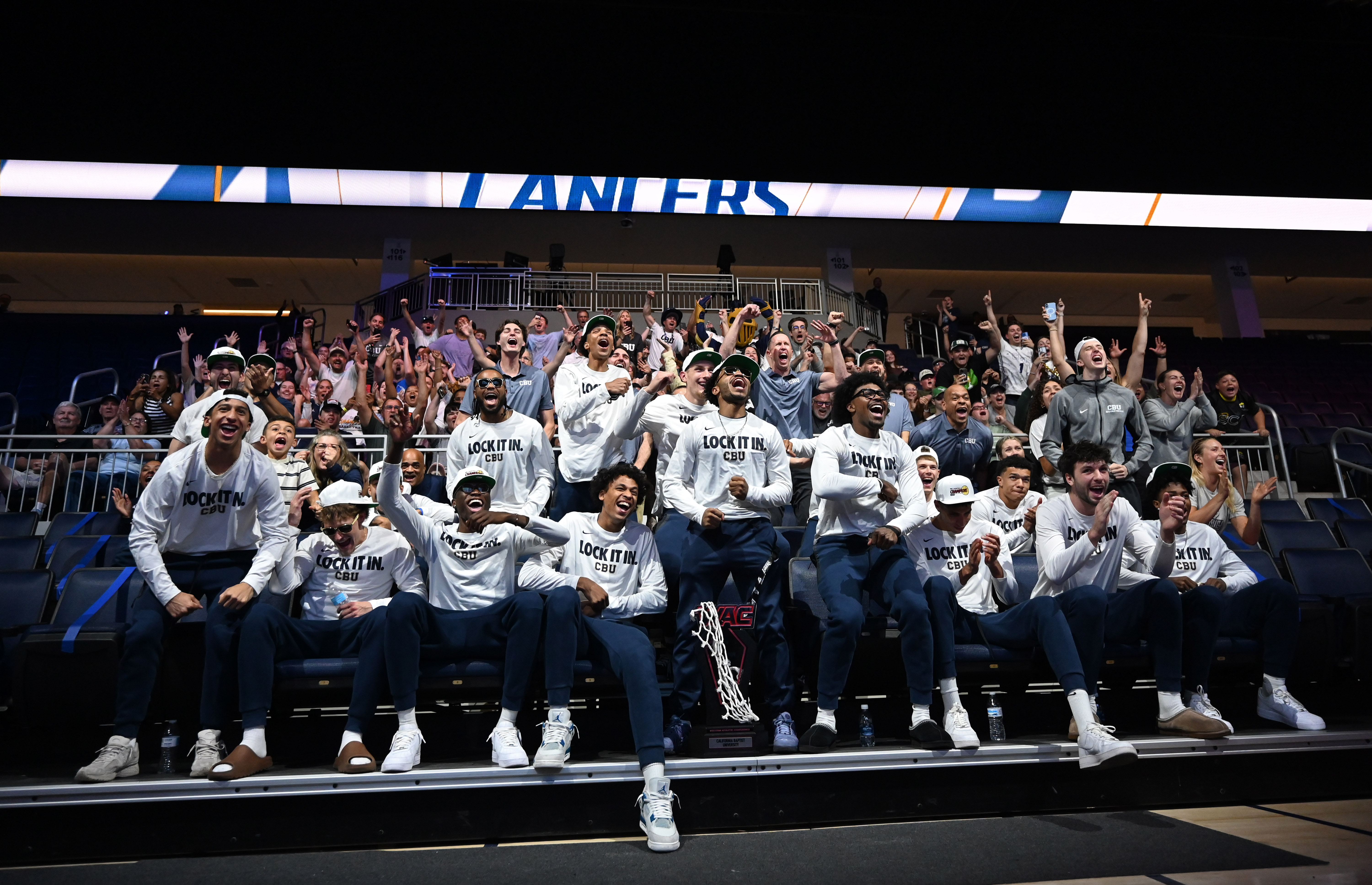 The California Baptist University men’s team reacts during a watch...