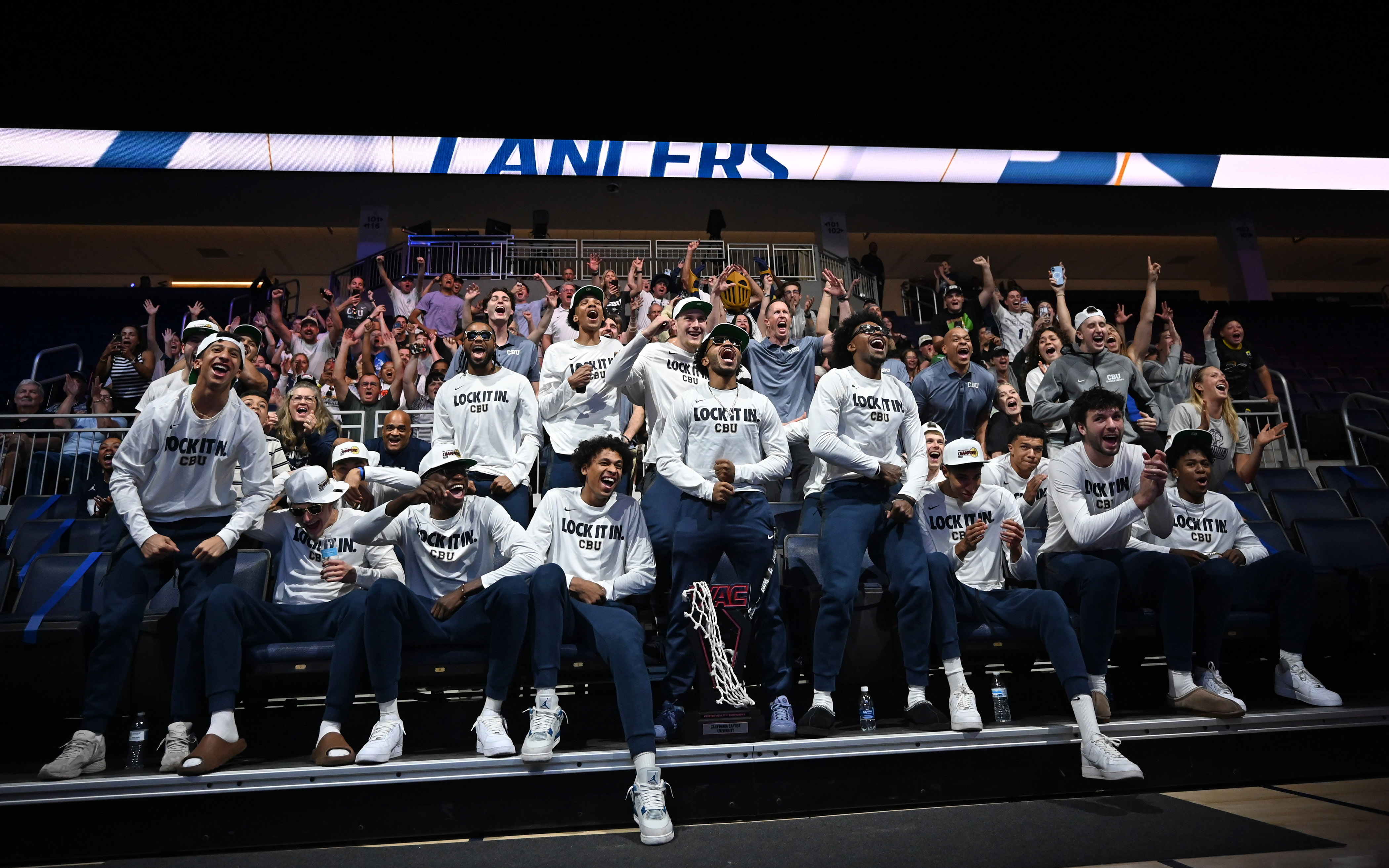 The California Baptist University men’s team reacts during a watch...