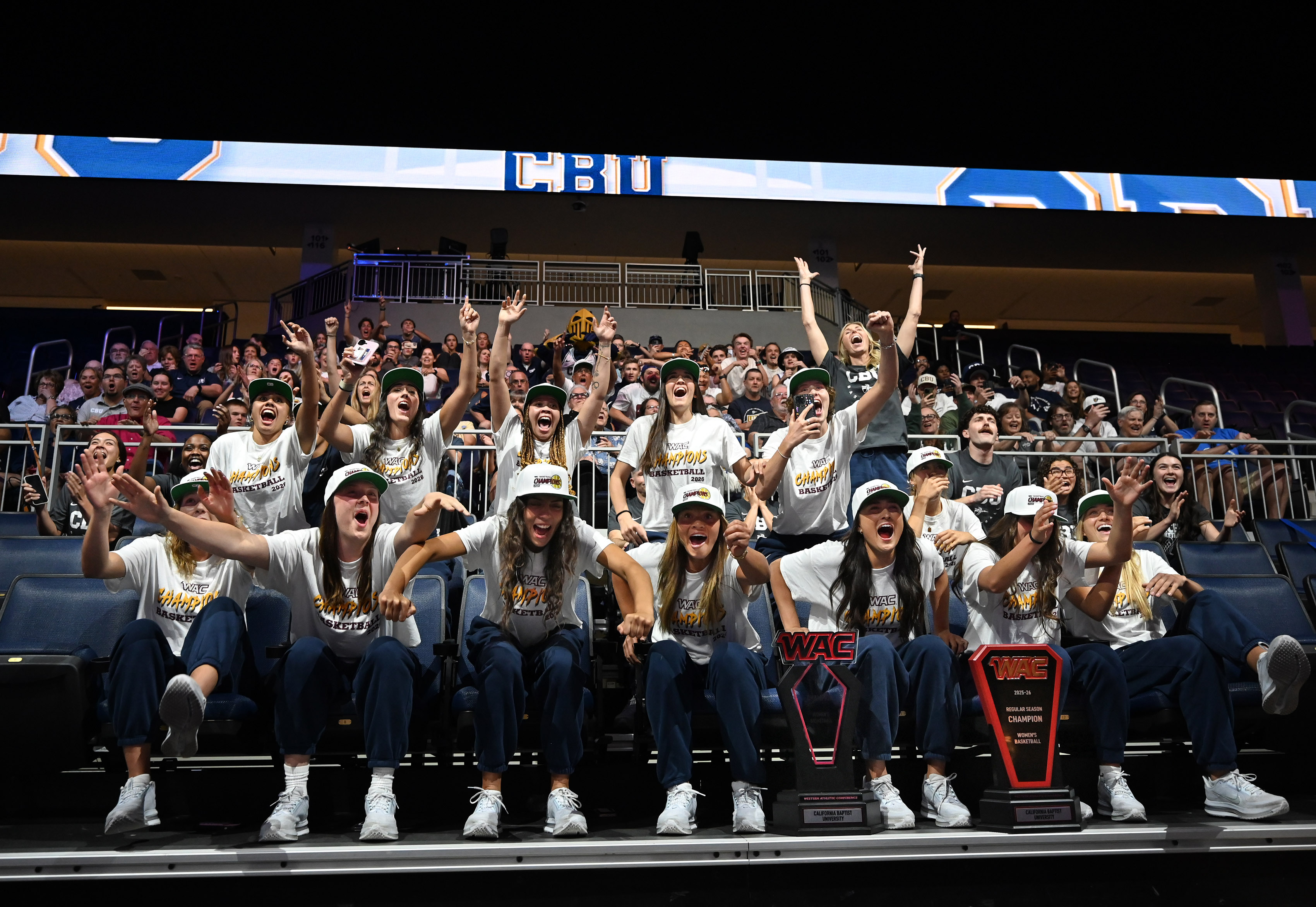 California Baptist University women’s team reacts during a watch party...