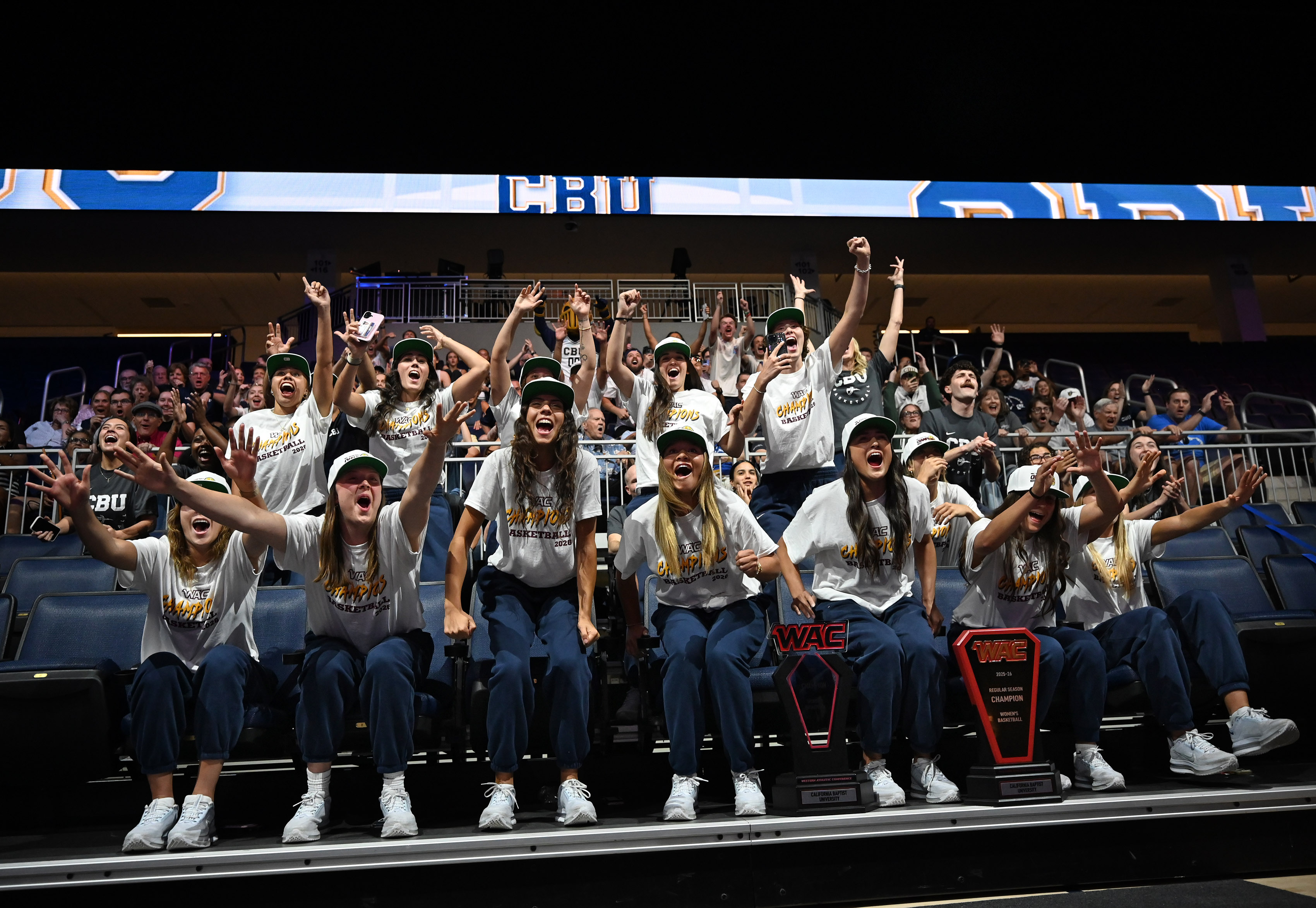 California Baptist University women’s team reacts during a watch party...