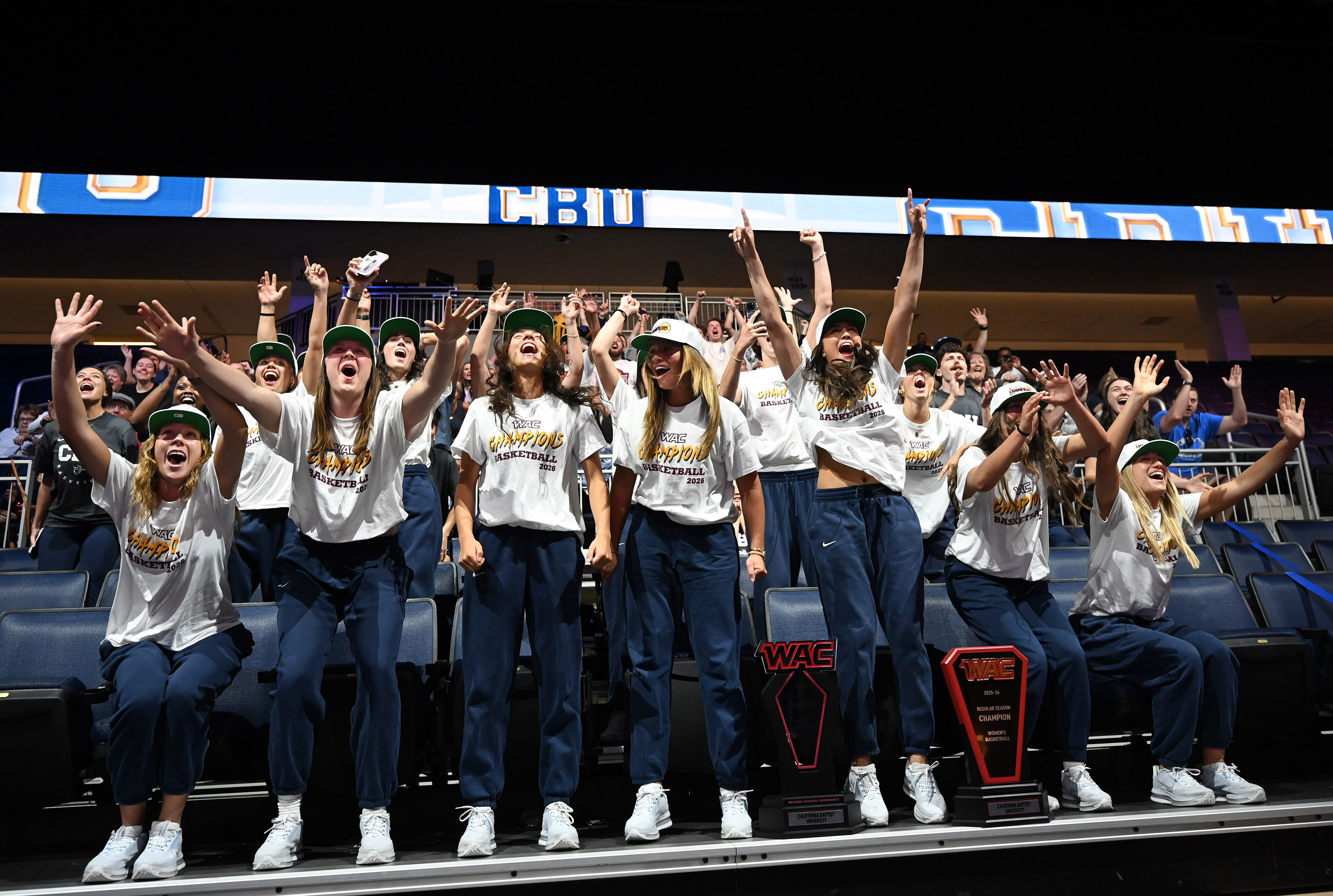 California Baptist University women’s team reacts during a watch party...