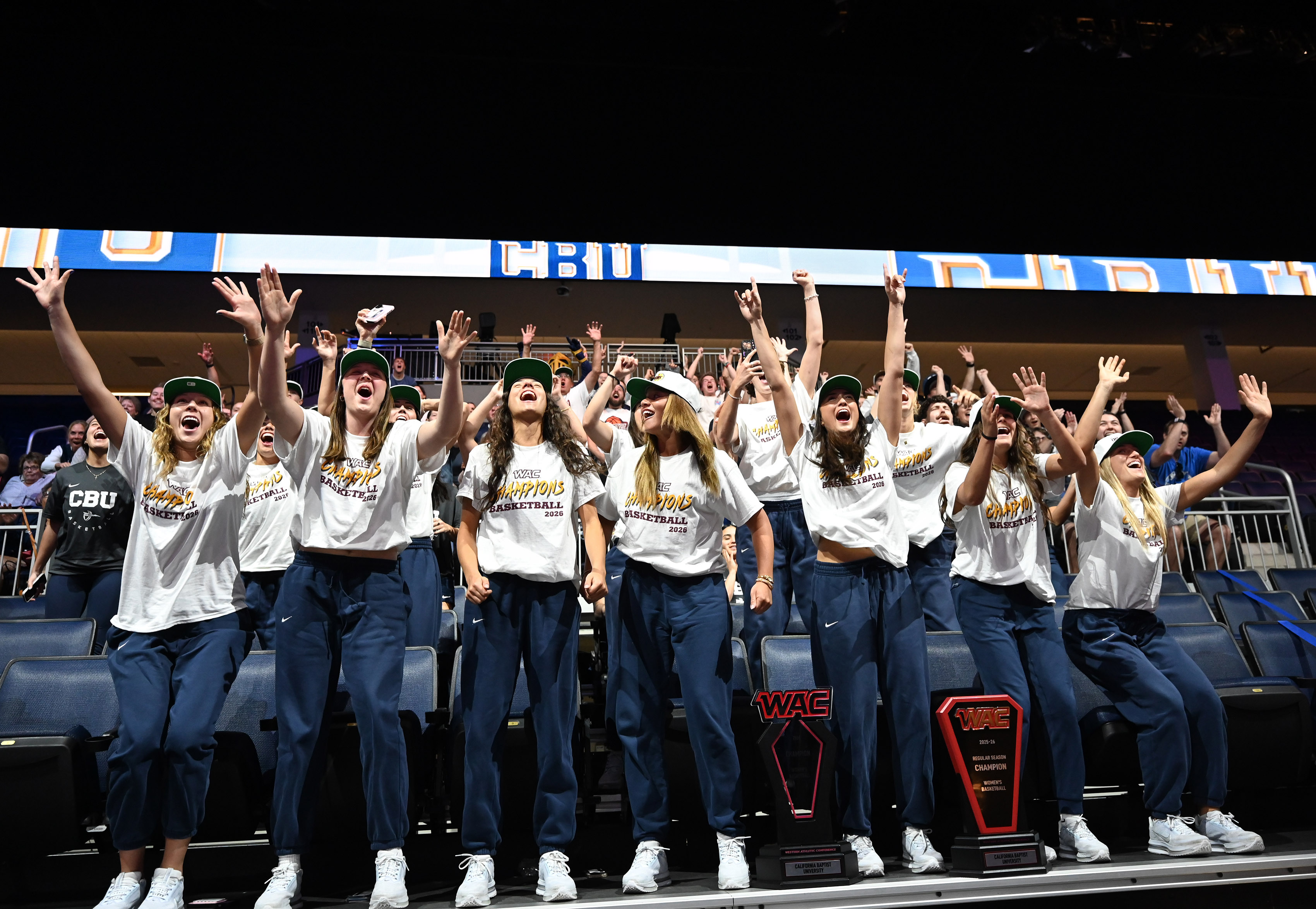 California Baptist University women’s team reacts during a watch party...