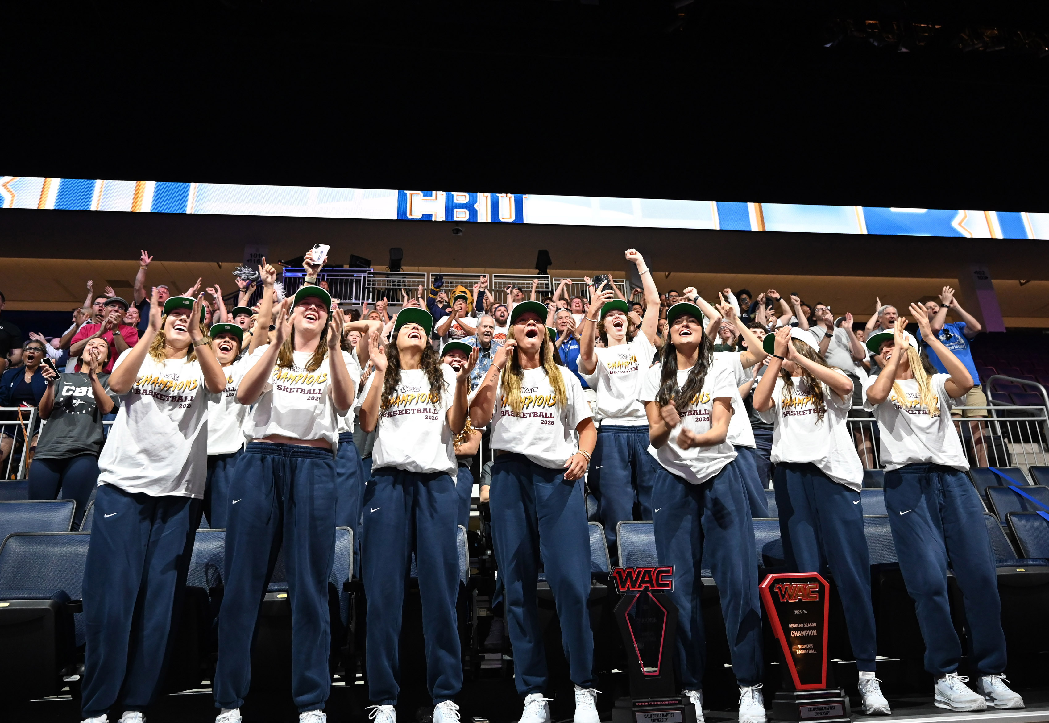 California Baptist University women’s team reacts during a watch party...
