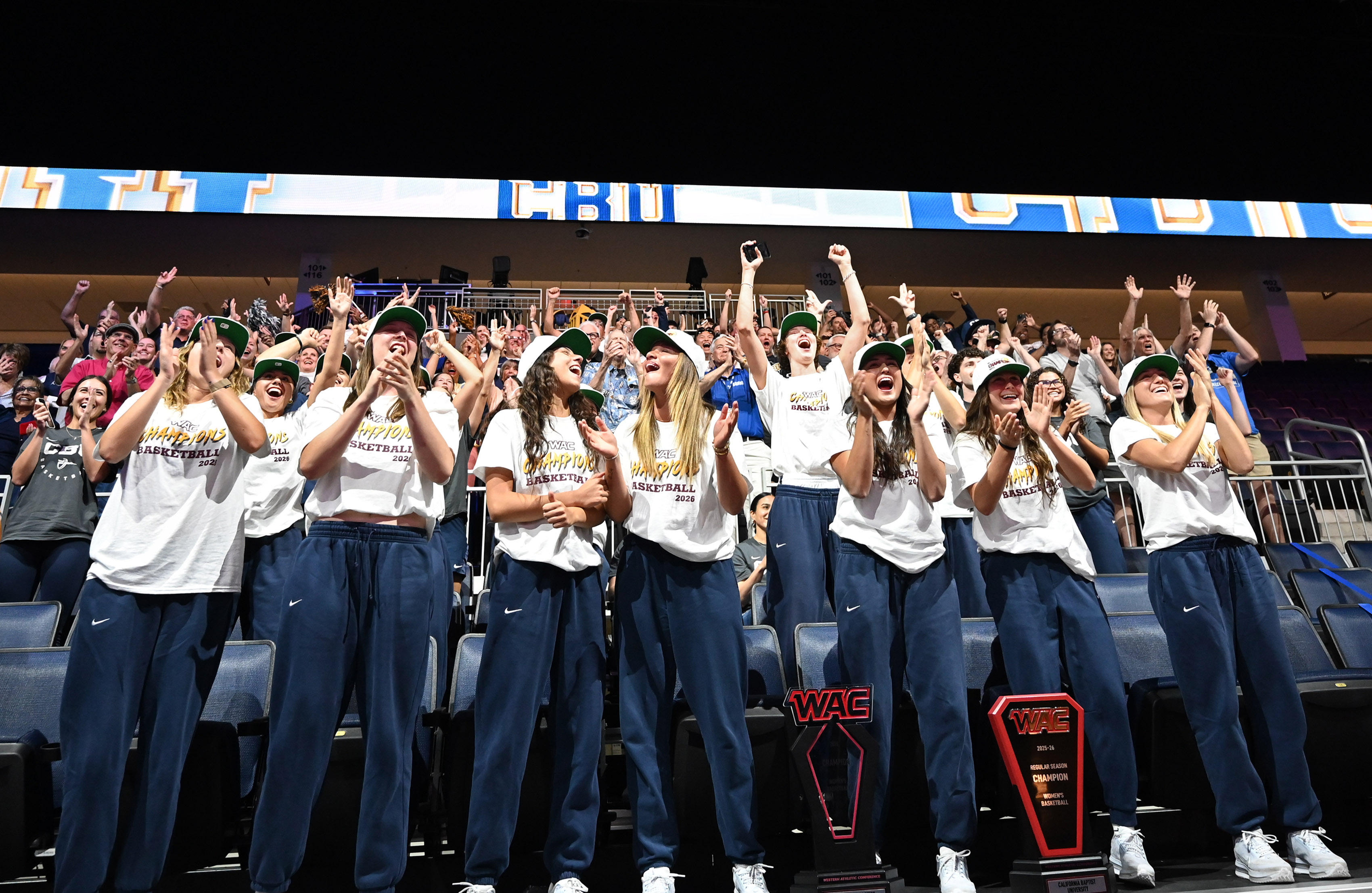 California Baptist University women’s team reacts during a watch party...
