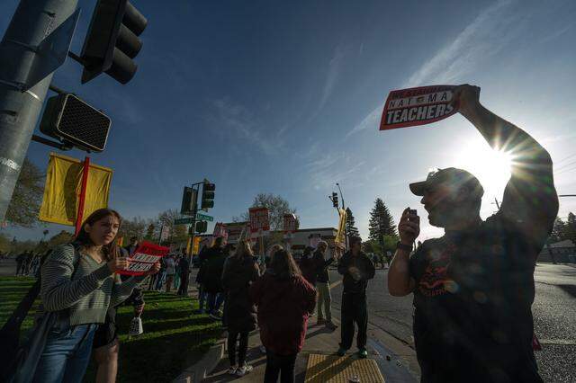 Jeff Bryan, an English teacher at Natomas High School, leads a chant with strikers on Tuesday, March 10, 2026, in front of the Sacramento school on the first day of the first strike in the school district's history.