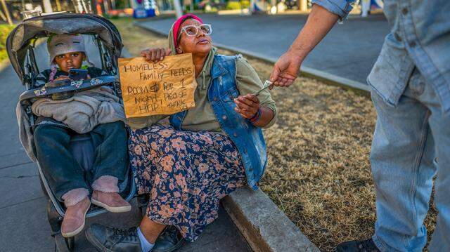 Tanika Williams, 40, asks for money alongside her daughter, Makhìla Williams, 4, on March 9 in midtown Sacramento. Tanika says she doesn’t like to ask for money, but feels she has no choice because she does not want to sleep outside on the cement. A bystander gave her $2, leaving her $66 short of a hotel room. “I’m screaming inside and have cried my eyes out, but I have to keep it together for her — I have no pride when it comes to this,” she said.
