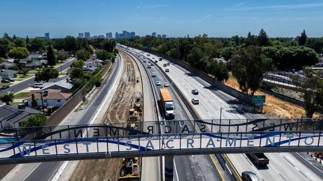 Traffic moves on Highway 50 in West Sacramento during the official opening of the landmark Sycamore Trail pedestrian and cyclist overpass on Thursday, May 29.