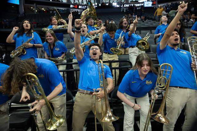 The UCLA Bruins band performs during a NCAA women’s basketball tournament Sweet 16 game against the Minnesota Golden Gophers at Golden 1 Center in Sacramento on Friday.