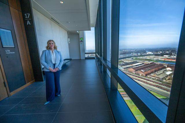 Court Executive Officer Kelly Sullivan stands in the hallway near a courtroom on the 17th floor of the Tani G. Cantil-Sakauye Sacramento Courthouse, with sweeping views of Sacramento's historic railyard, on Jan. 26.