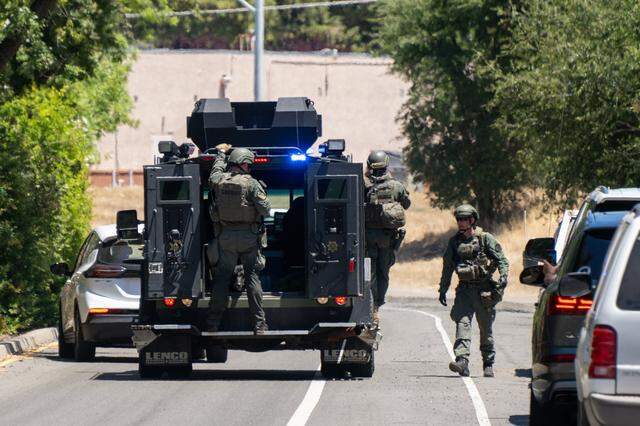 Police officers leave Zion Court in Rocklin after murder suspect Eric James Abril was captured behind the property on Monday, July 10, 2023, a day after he escaped custody from a Roseville hospital.