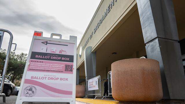 A sign directs voters to the ballot box at the Sacramento County Voter Registration and Elections office on Tuesday, Nov. 5, 2024.